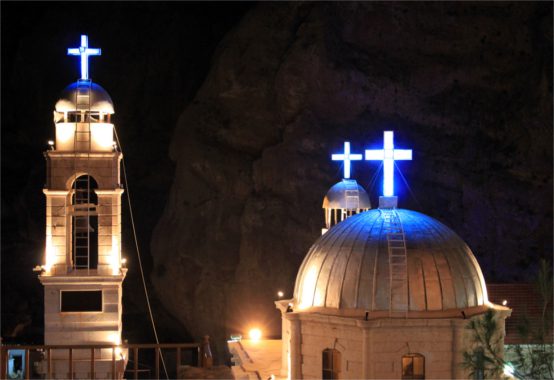 Blue crosses and towers in monastery Saint Takla in Maalula near Damascus