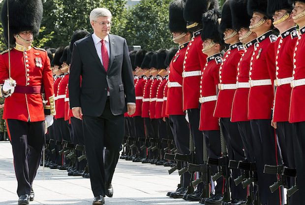 stephen harper men with hats and guns