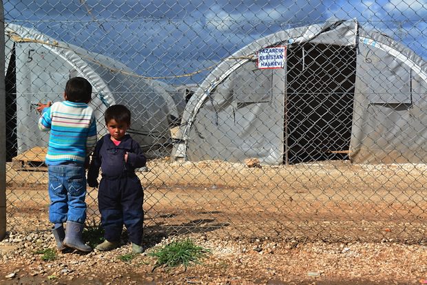 syria refugees two boys tent