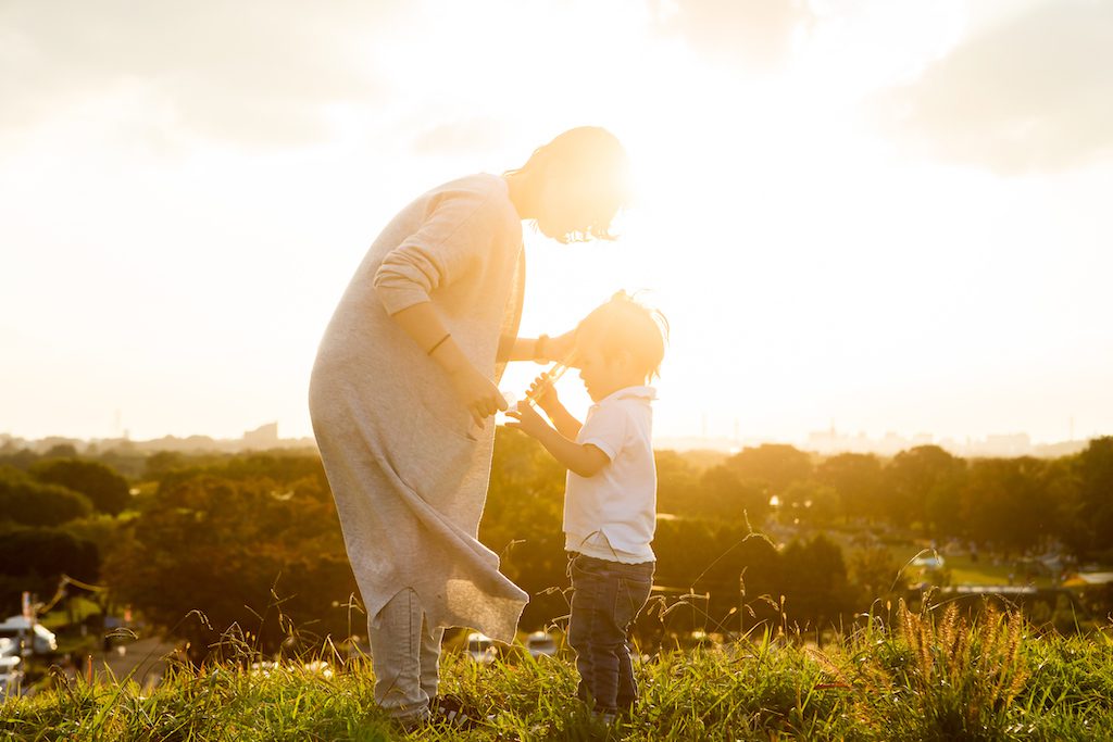 Sunset and mother and son