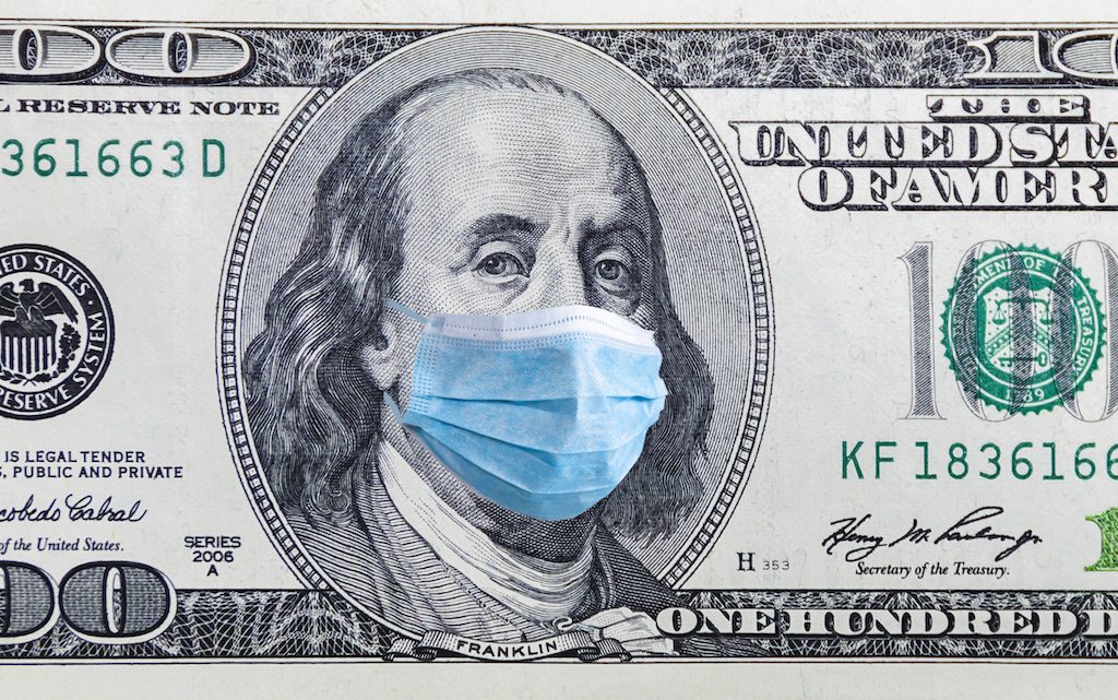 US quarantine, 100 dollar banknote with medical mask. The concept of epidemic and protection against coronavrius.