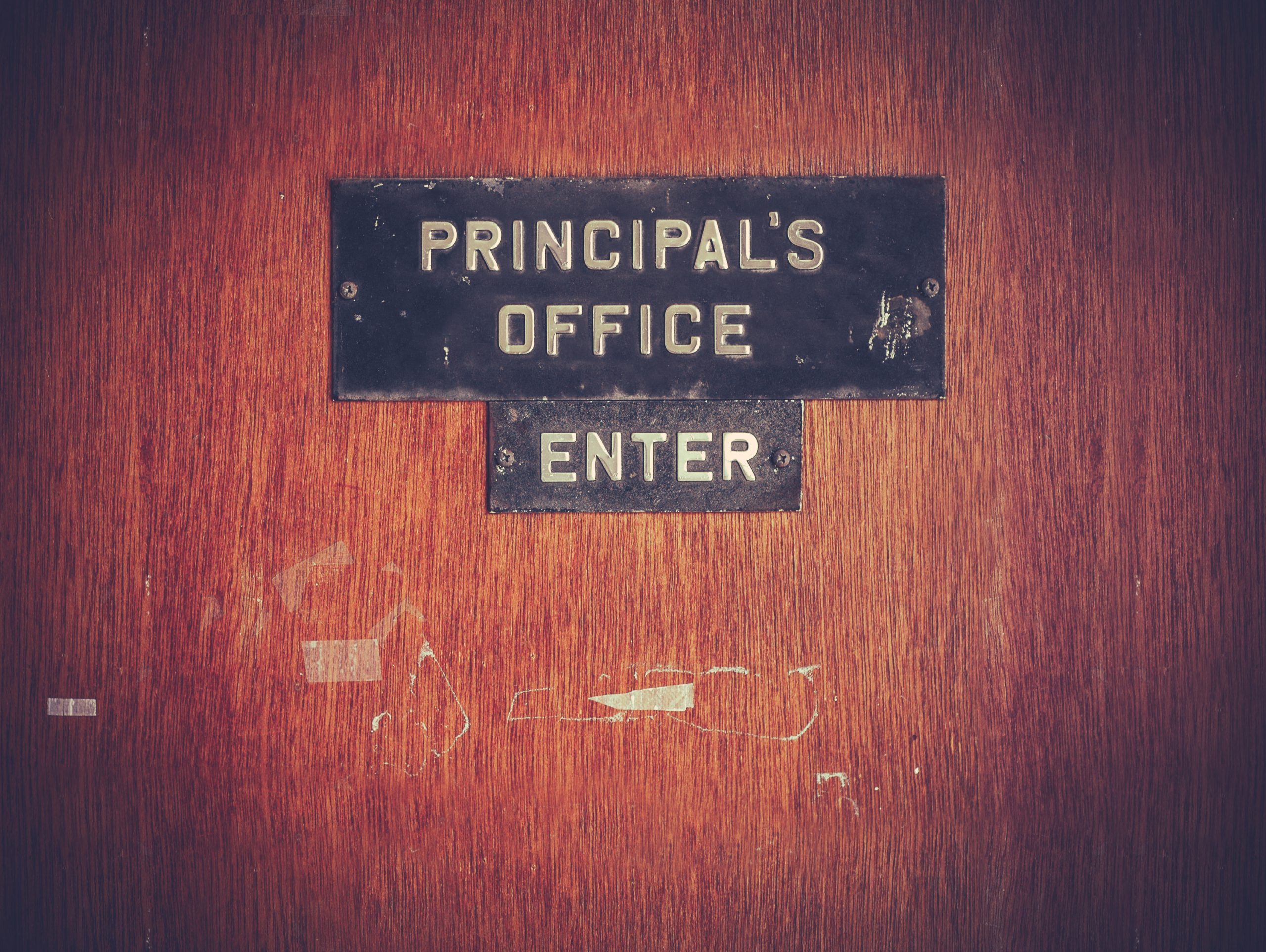 Retro,Filtered,Image,Of,A,Grungy,Principal's,Office,Door,At