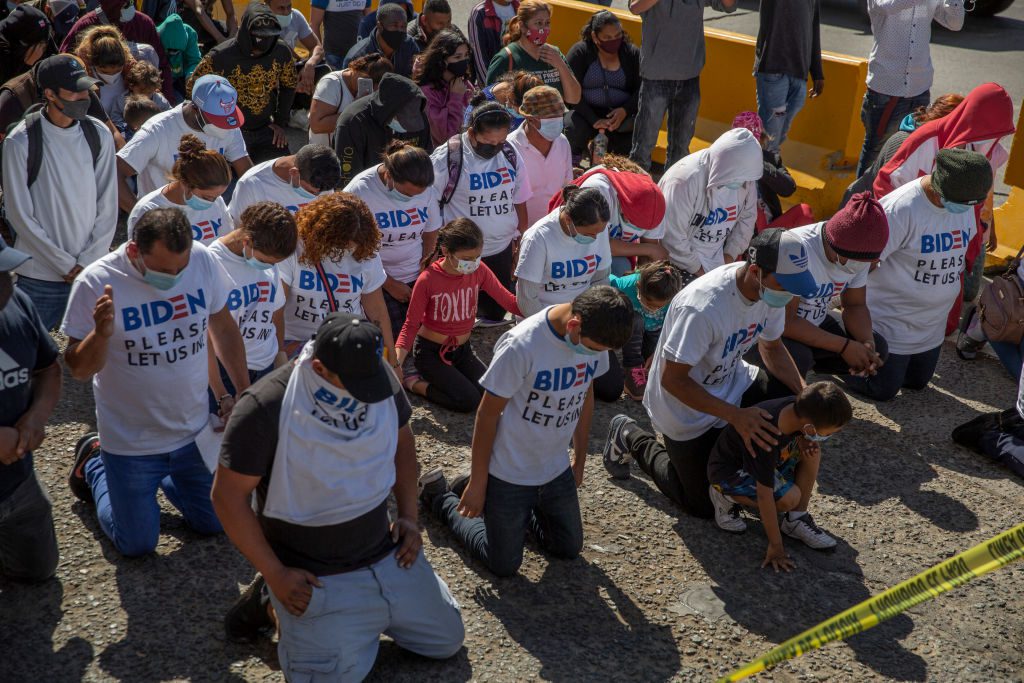 Migrants at the border between Mexico and the USA
