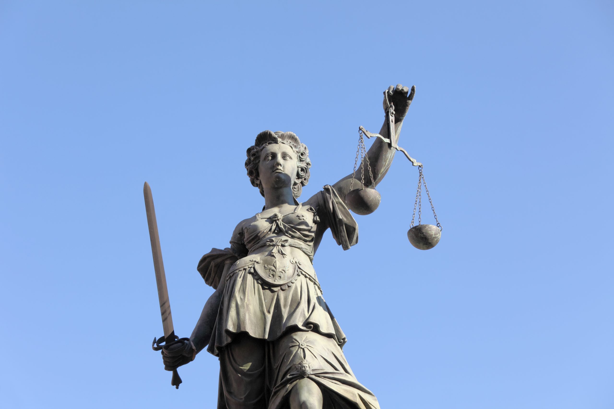 Lady Justice against blue sky