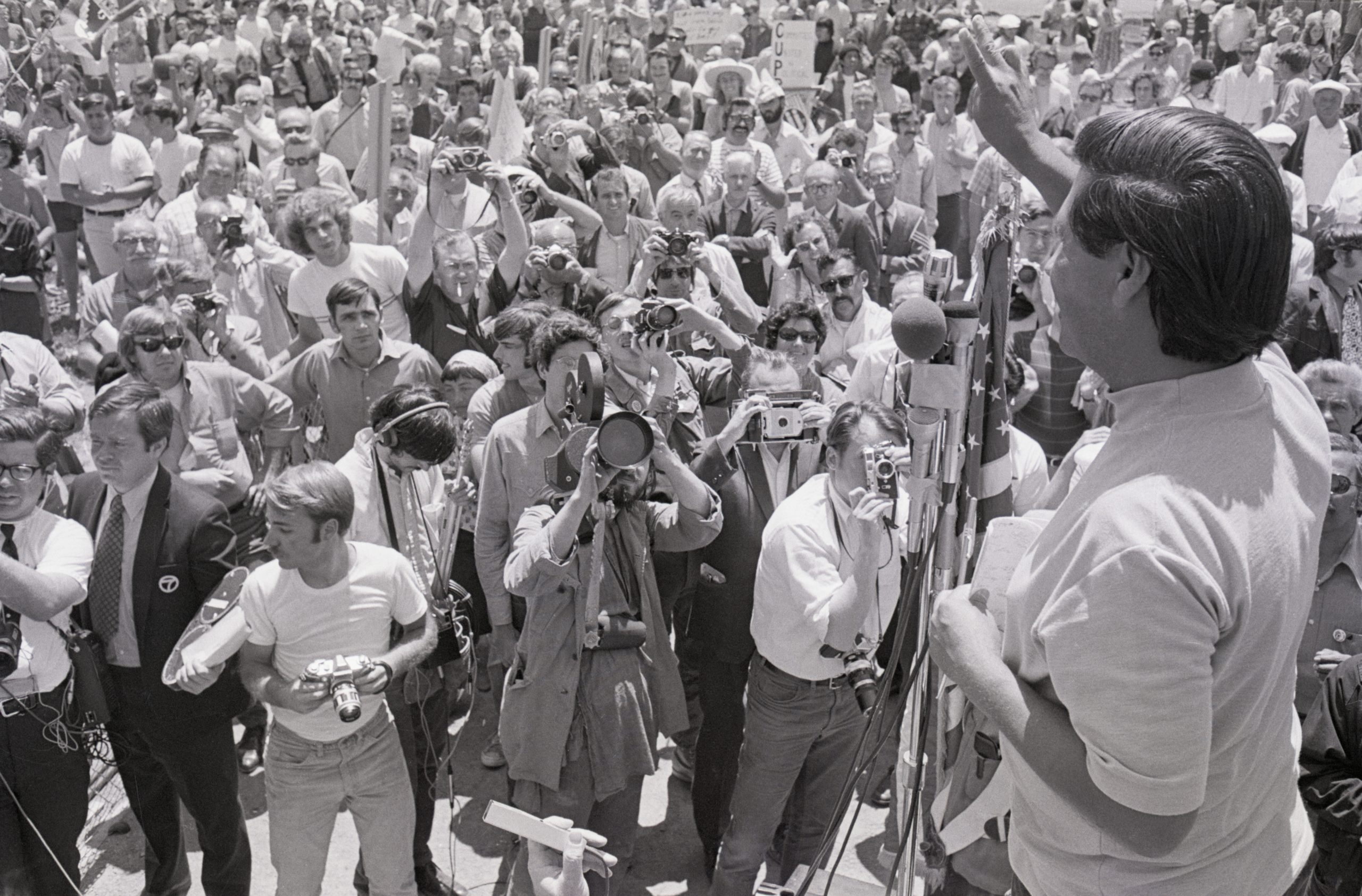 Cesar Chavez Gives Crowd Peace Sign