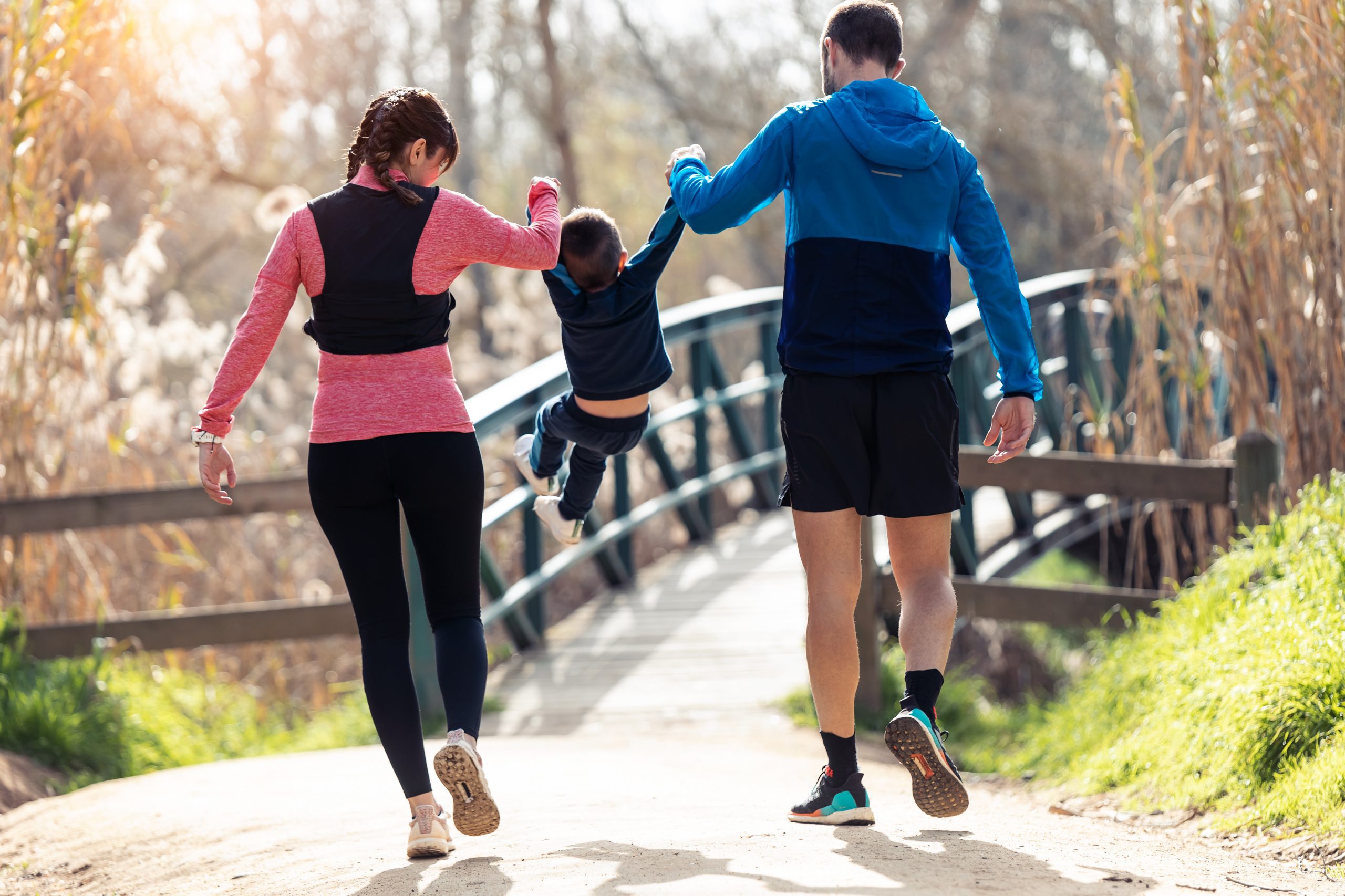 Shot,Of,Sporty,Young,Couple,With,Her,Little,Son,Playing
