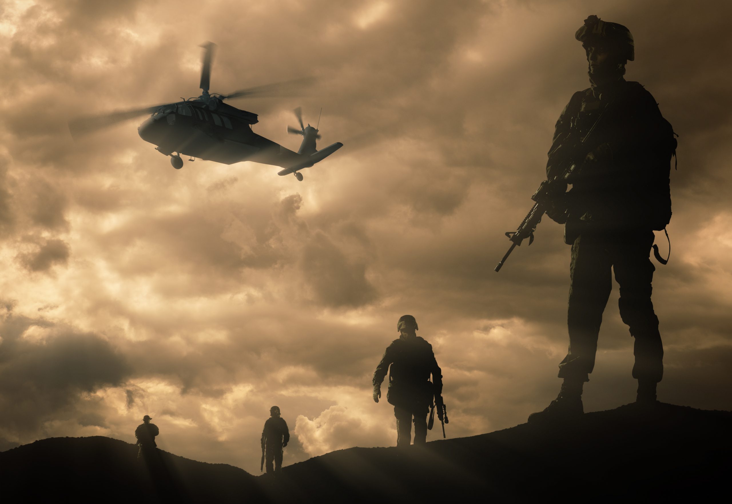 Military,Silhouettes,Of,Soldiers,Against,The,Backdrop,Of,Sunset,Sky.