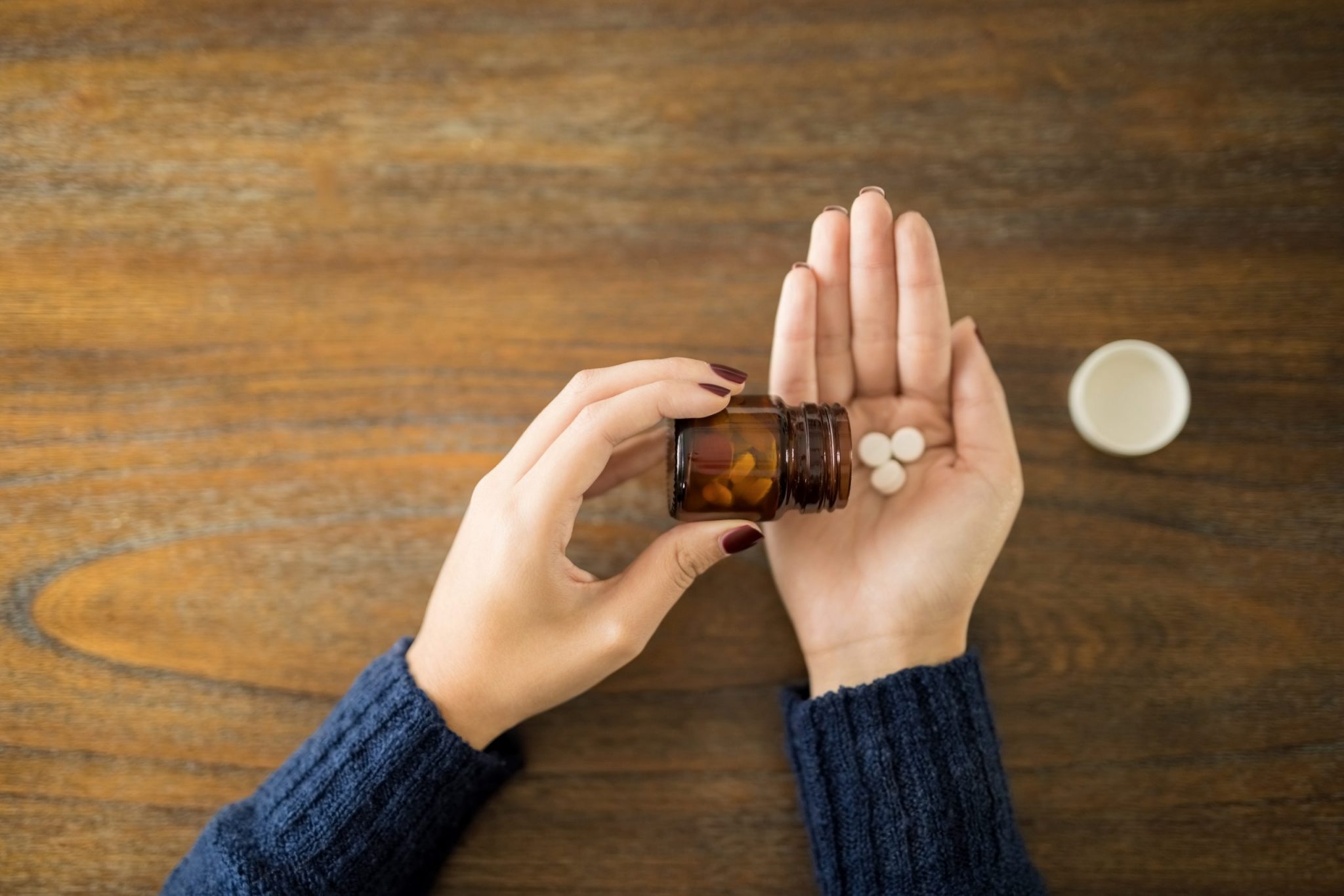 Point,Of,View,Of,Female,Spilling,Pills,Onto,Hand,Over