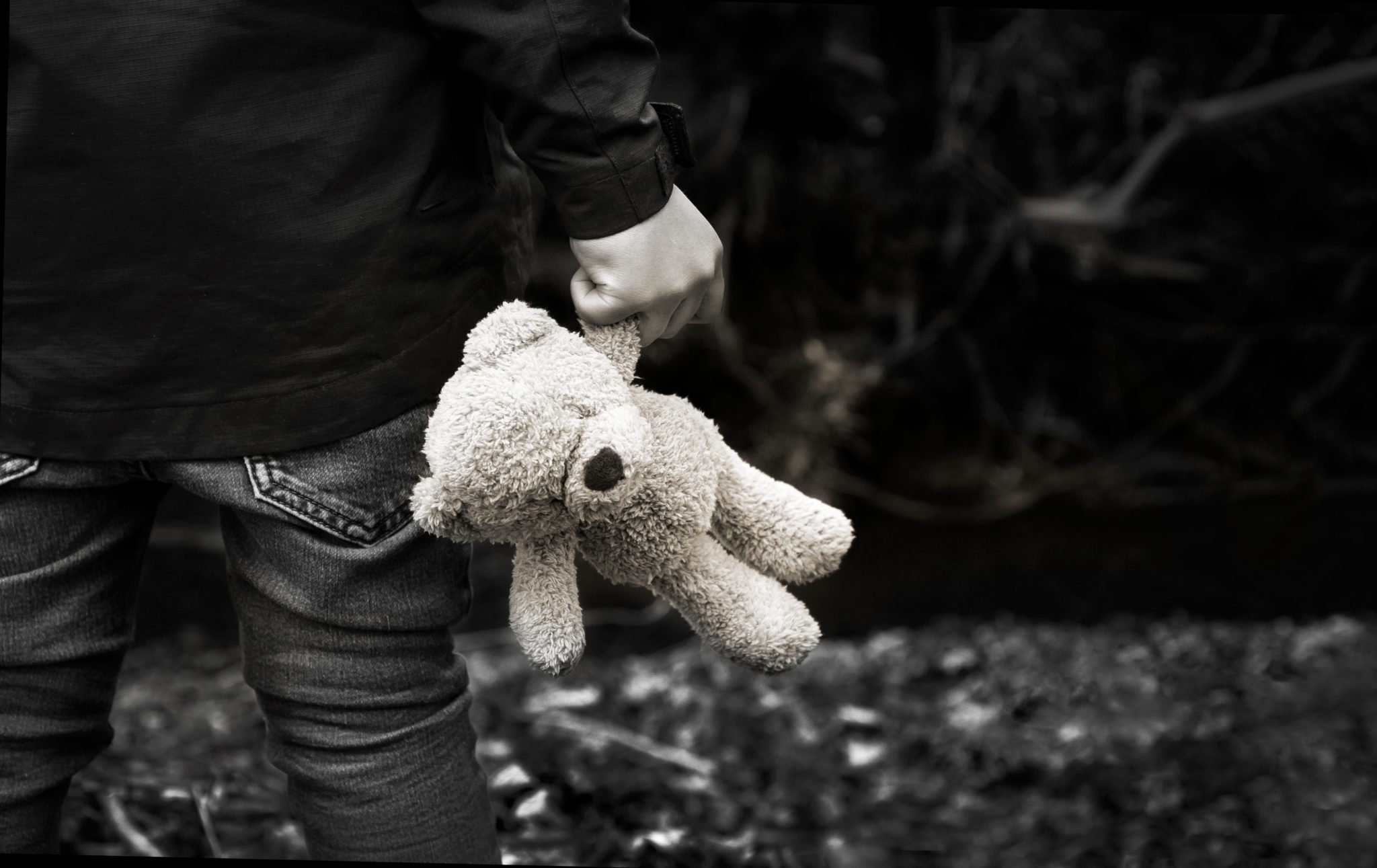Black,And,White,Photo,Of,Kid,Holding,Teddy,Waking,Alone