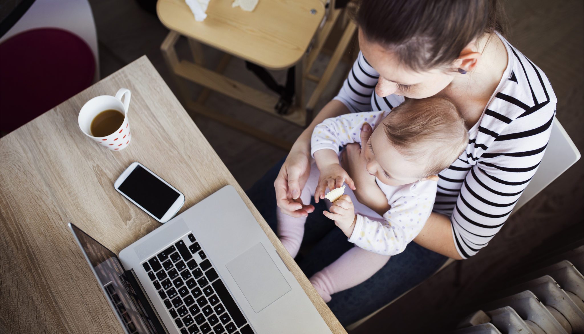 Young,Mother,In,Home,Office,With,Computer,And,Her,Daugher