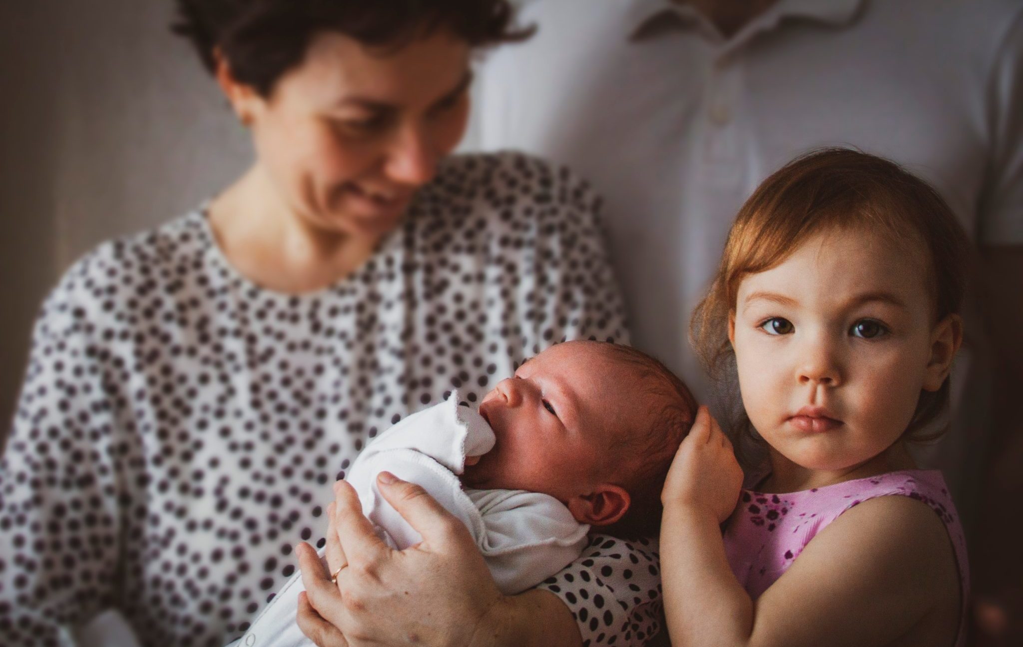 Happy,Parents,With,Two,Small,Children