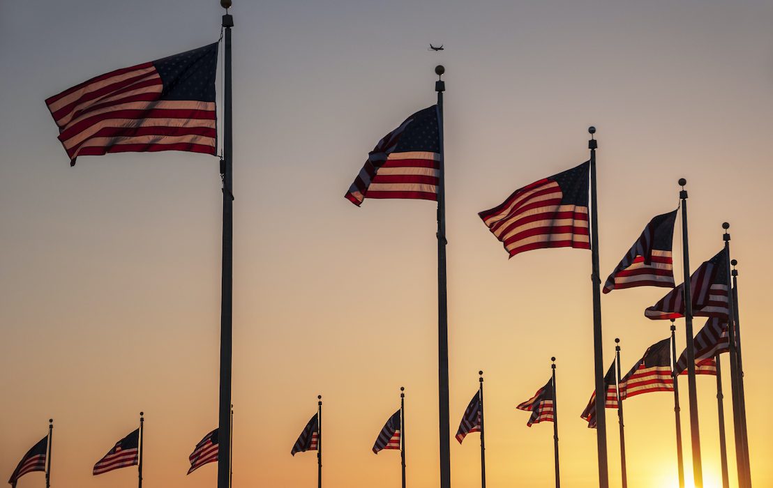 Flags,Around,The,Base,Of,The,Washington,Monument,At,Sunset
