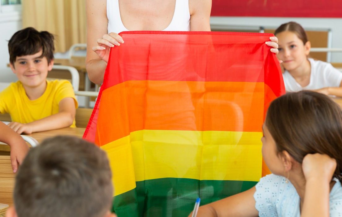 Schoolchildren,Sitting,In,Classroom,And,Listening,To,Female,Teacher.,She