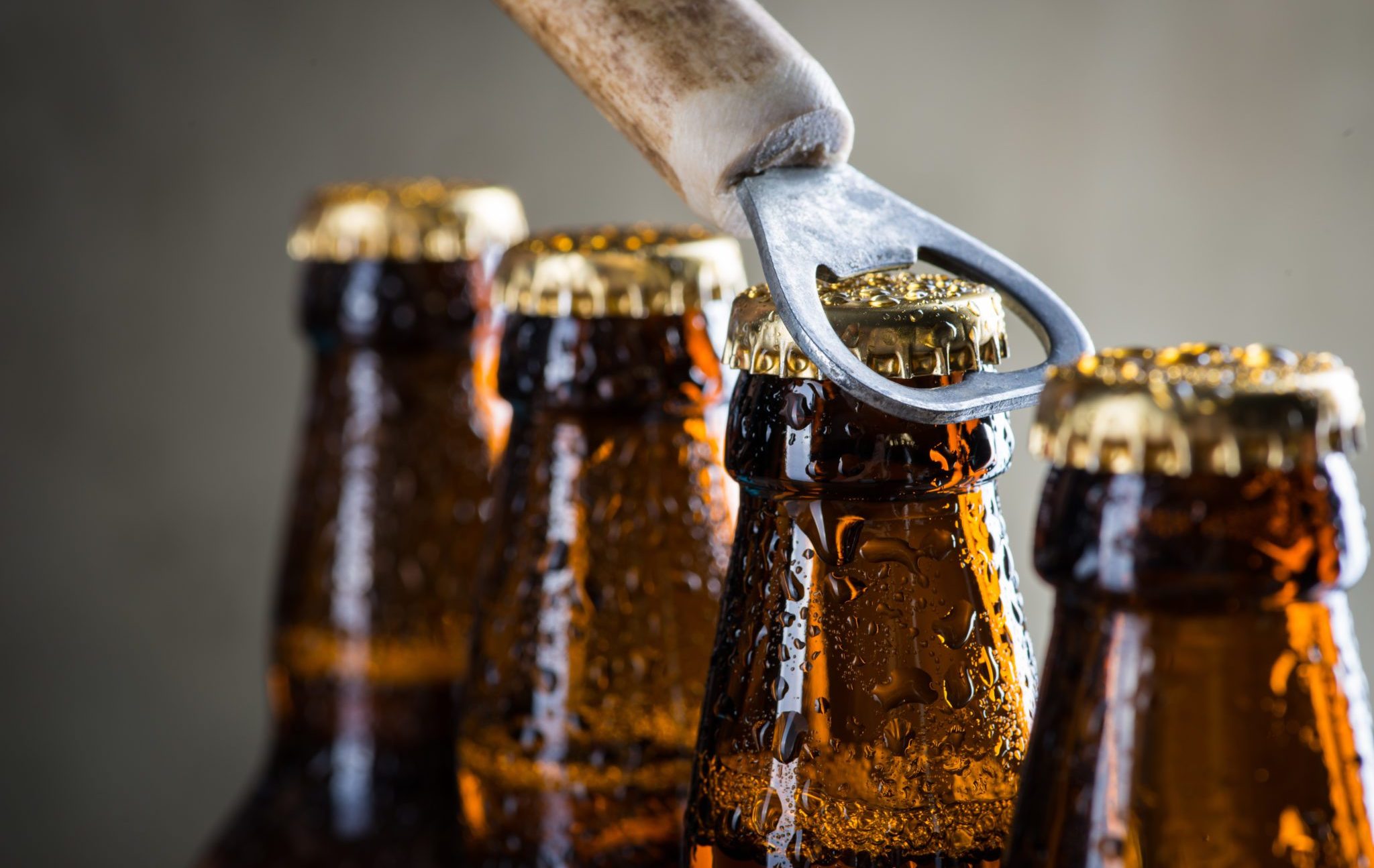 Brown,Ice,Cold,Beer,Bottles,With,Water,Drops,And,Old