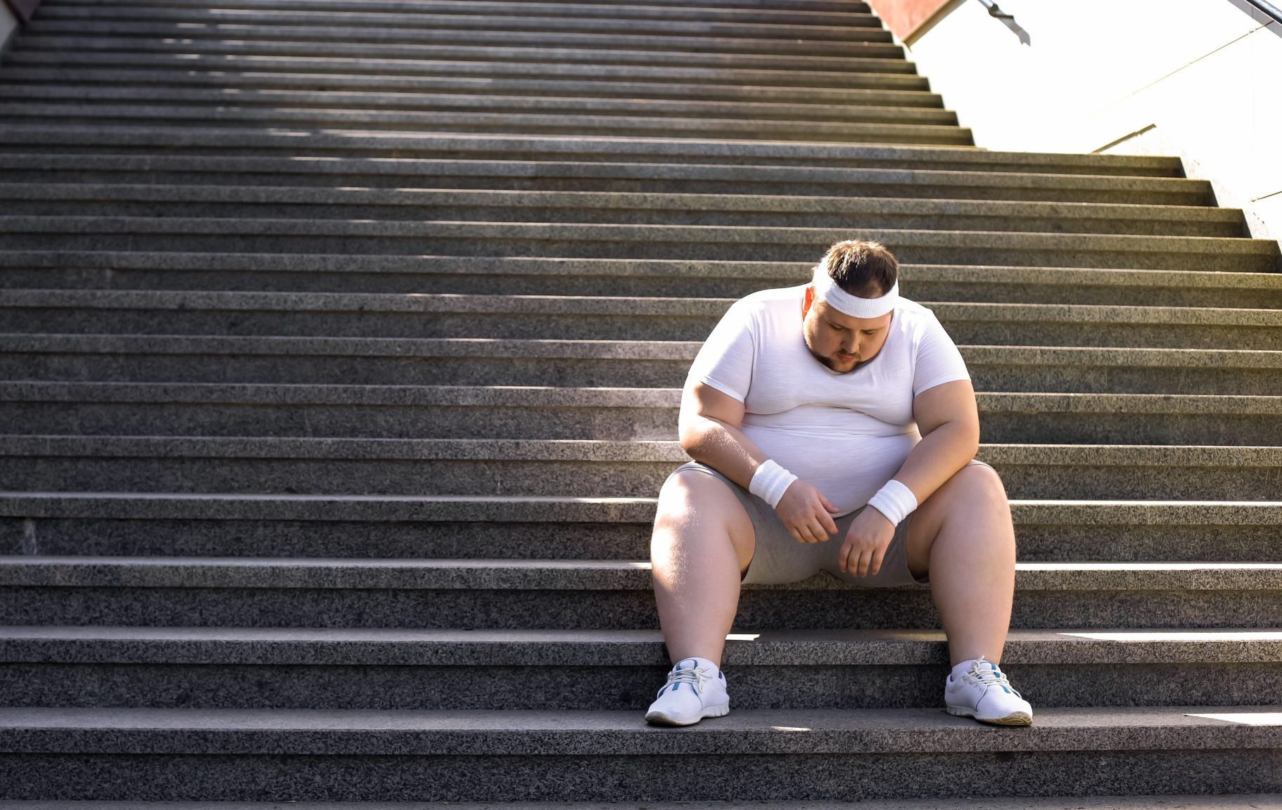 Fat,Man,Sitting,On,Stairs,After,Jogging,,No,Faith,In