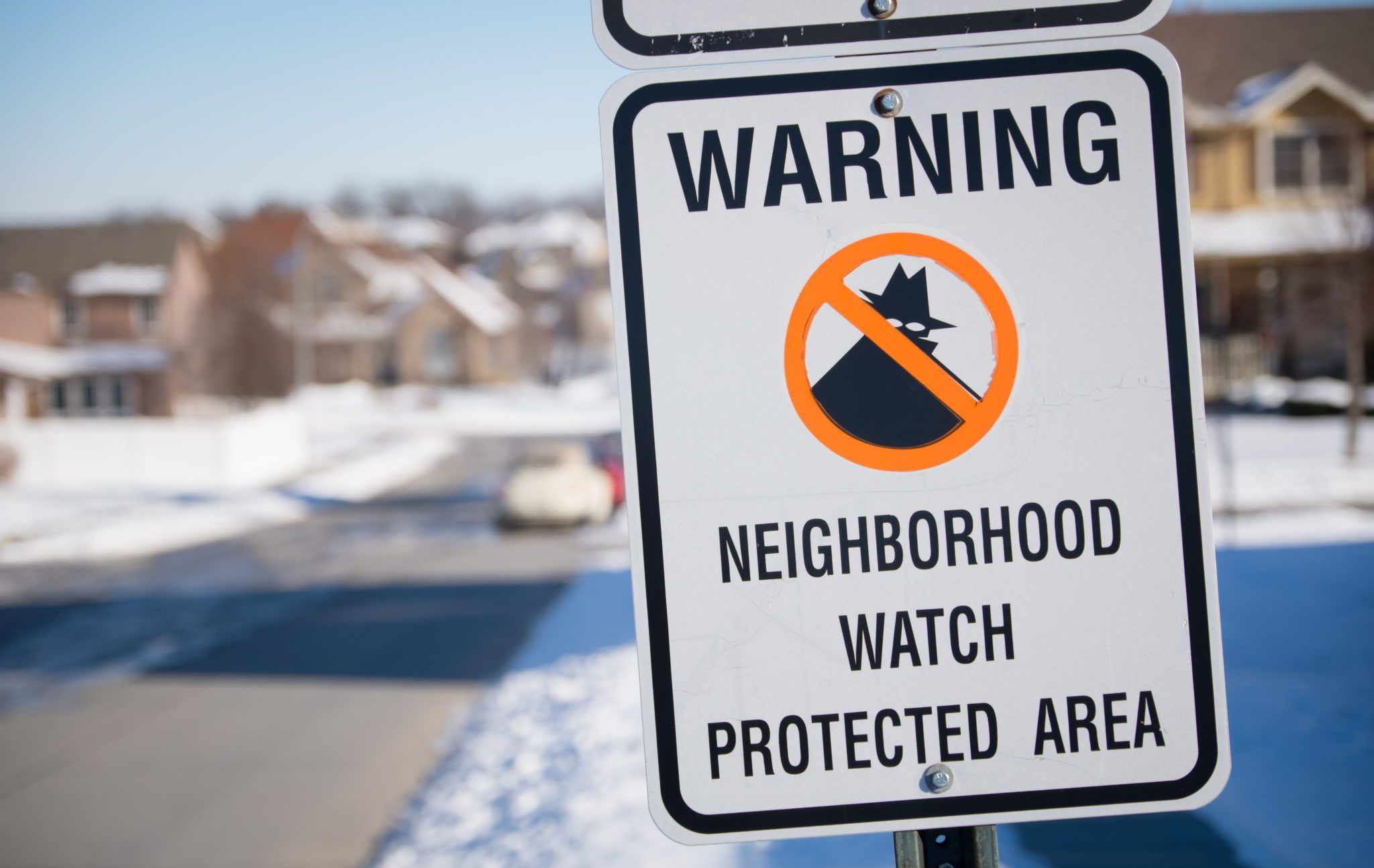 Neighborhood,Watch,Sign,In,A,Snowy,Midwest,Suburb.