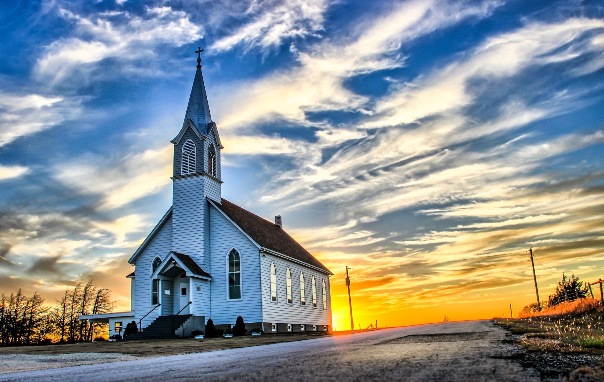 A,Lone,Wooden,Church,At,Dusk,With,Sunset,Clouds,In