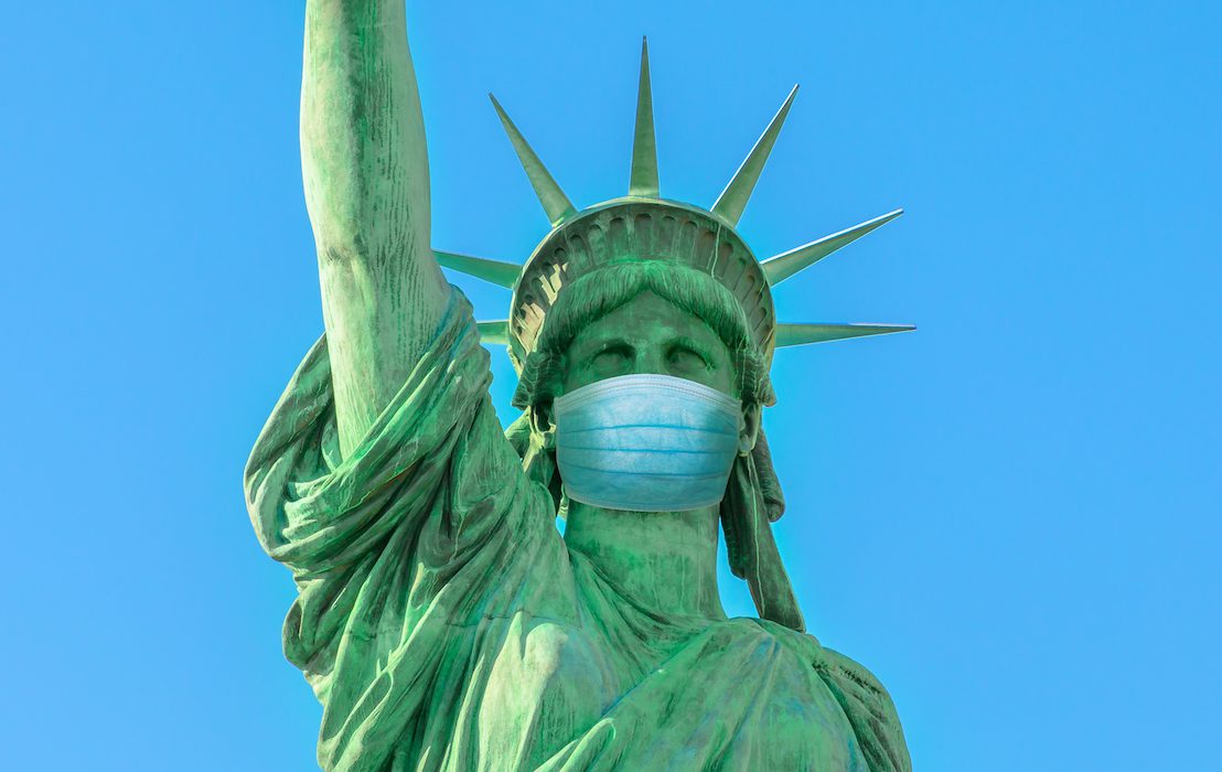 Close,Up,Of,Statue,Of,Liberty,With,Surgical,Mask,,Symbol