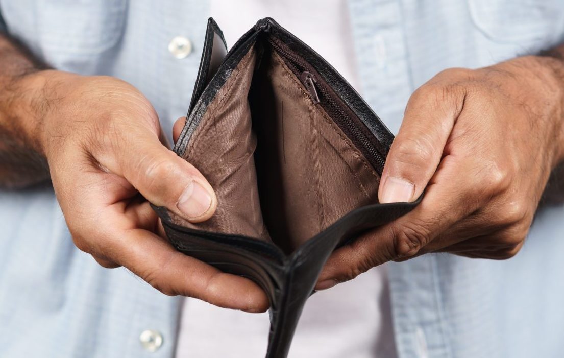 Close,Up,Of,Man,Hands,Holding,And,Empty,Wallet,On