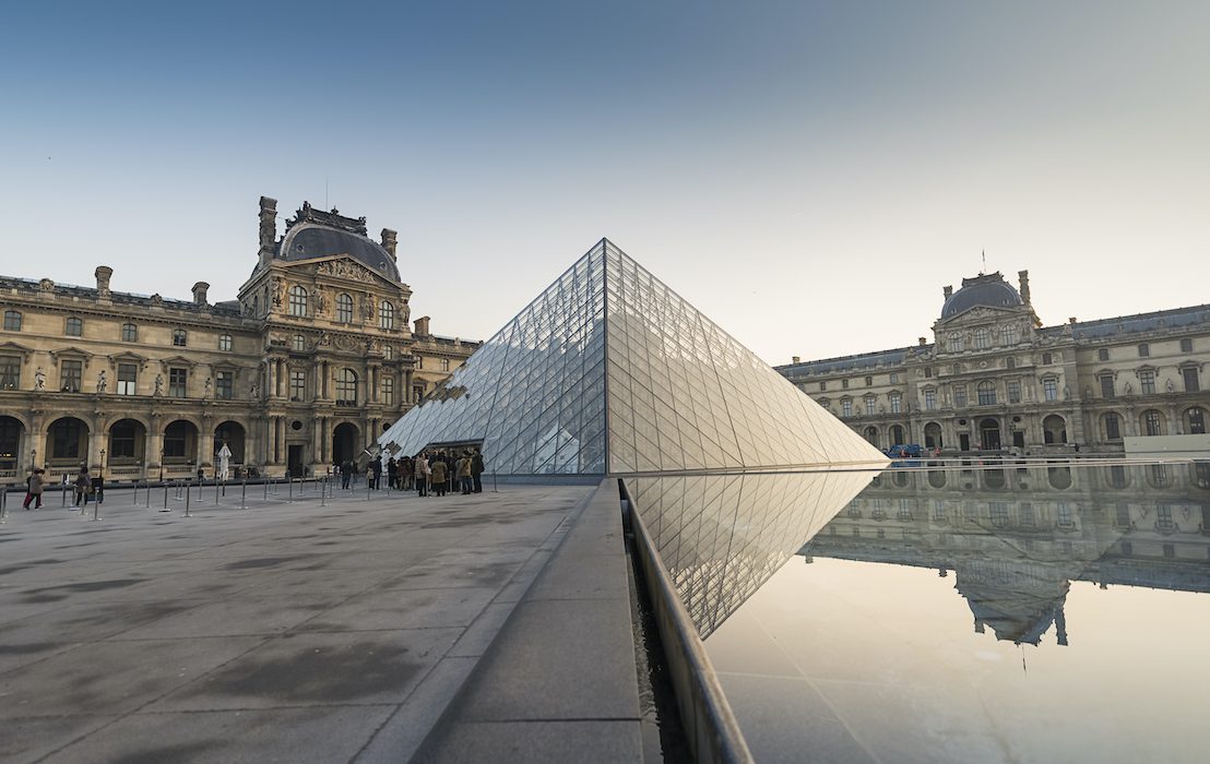 Paris,,France-february,10,2015:louvre,Pyramid,Of,Museum,With,Clear,Sky.,It
