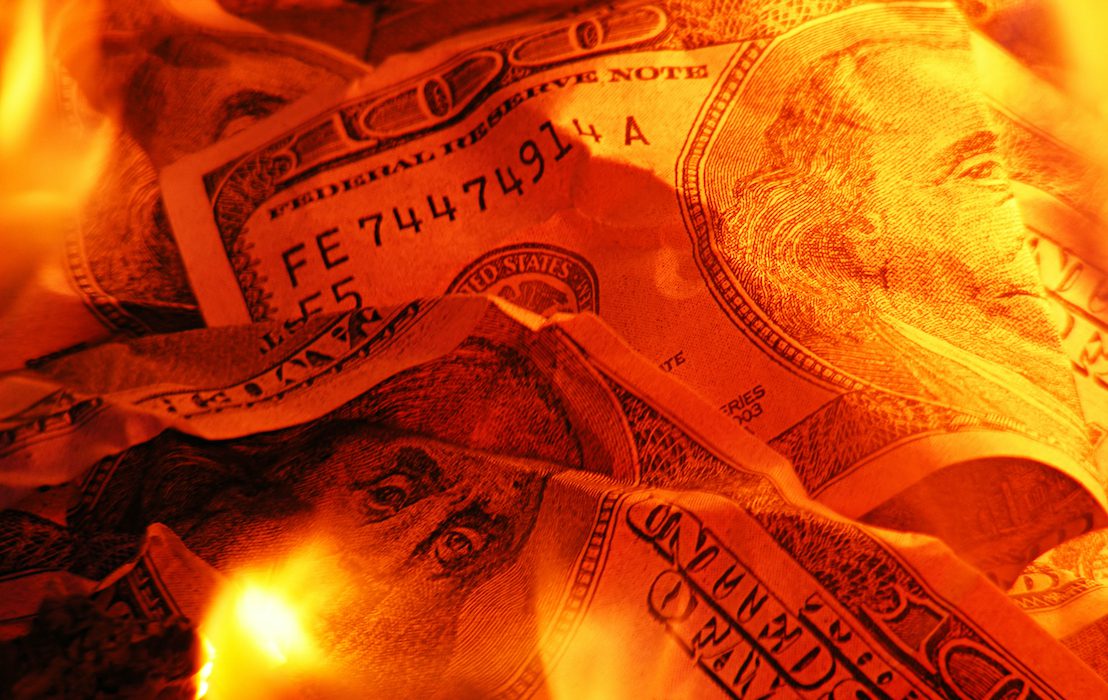 Closeup,Photo,Of,Burning,Dollars
