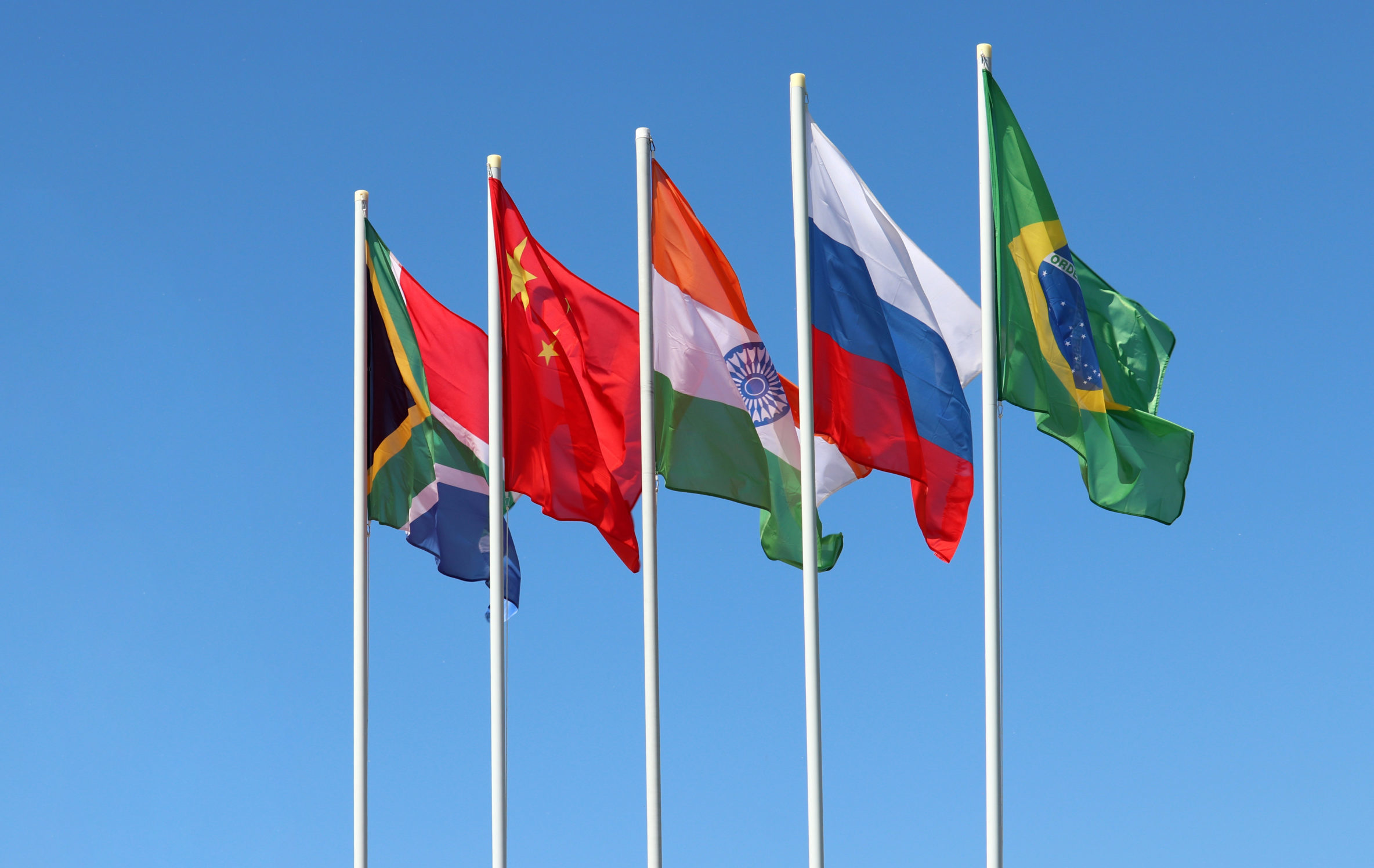 Waving,Flags,Of,The,Brics,Countries,Against,The,Clear,Blue