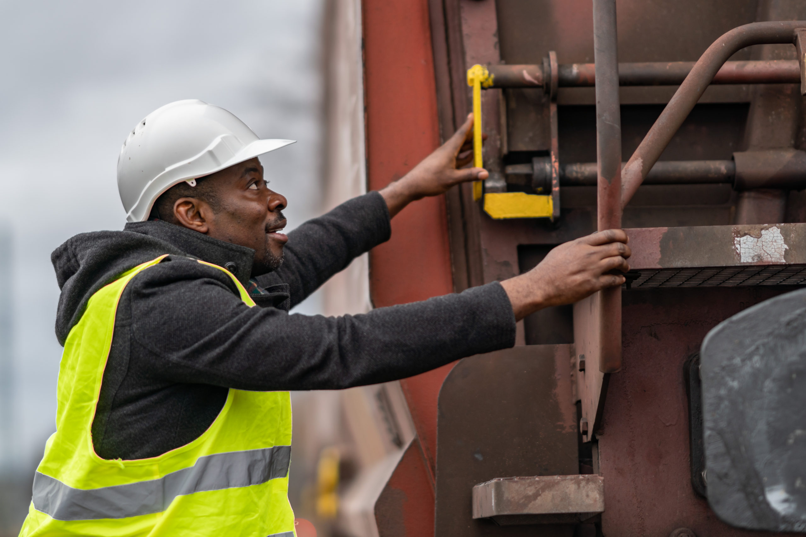 African,American,Railroad,Engineer,Wearing,Safety,Equipment,(helmet,And,Jacket)