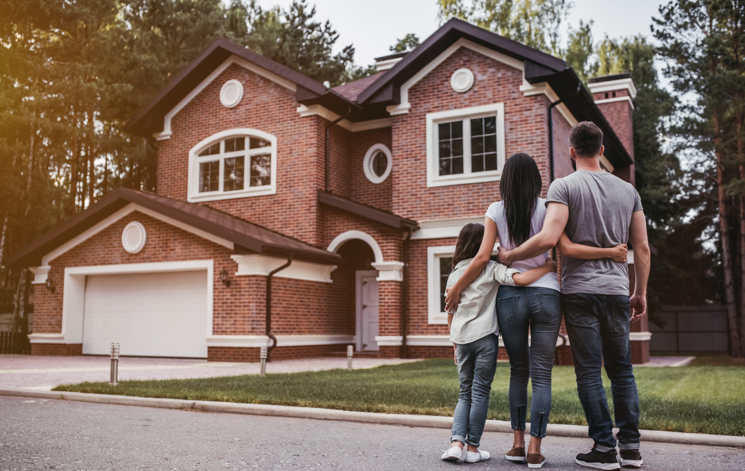 Back,View,Of,Happy,Family,Is,Standing,Near,Their,Modern