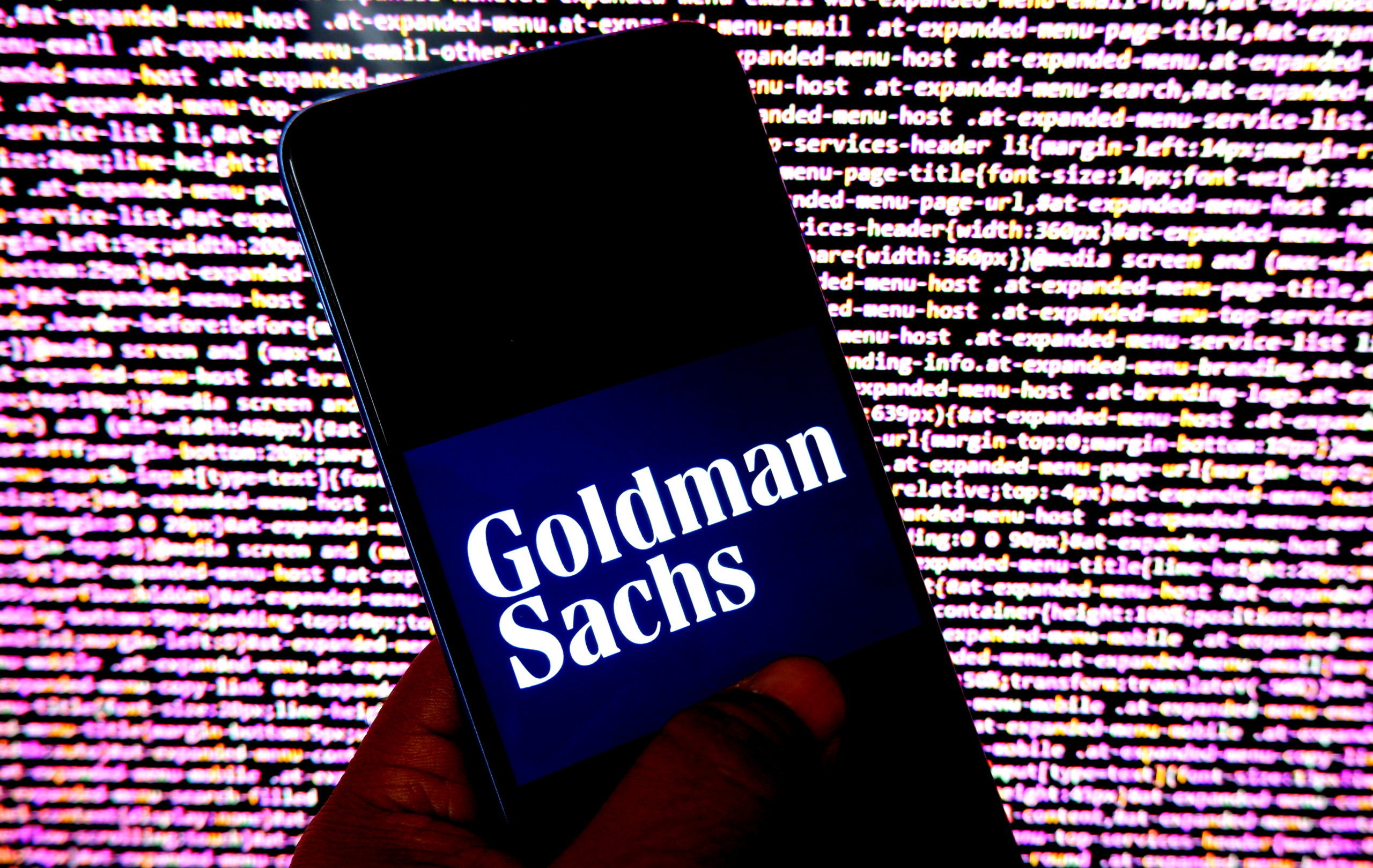 In this photo illustration, a Goldman Sachs logo is