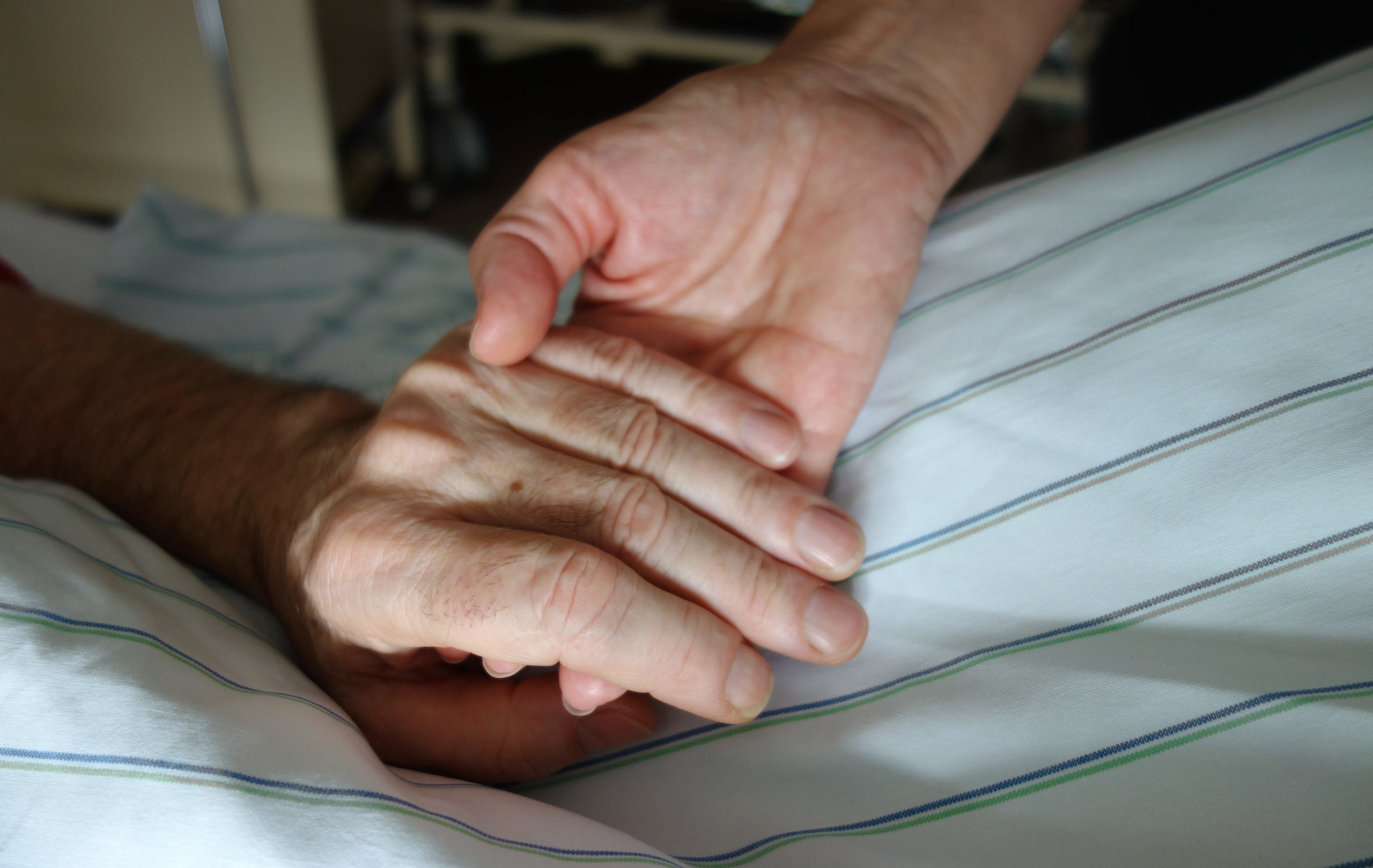 Nurse,Holding,A,Hand,Of,A,Patient
