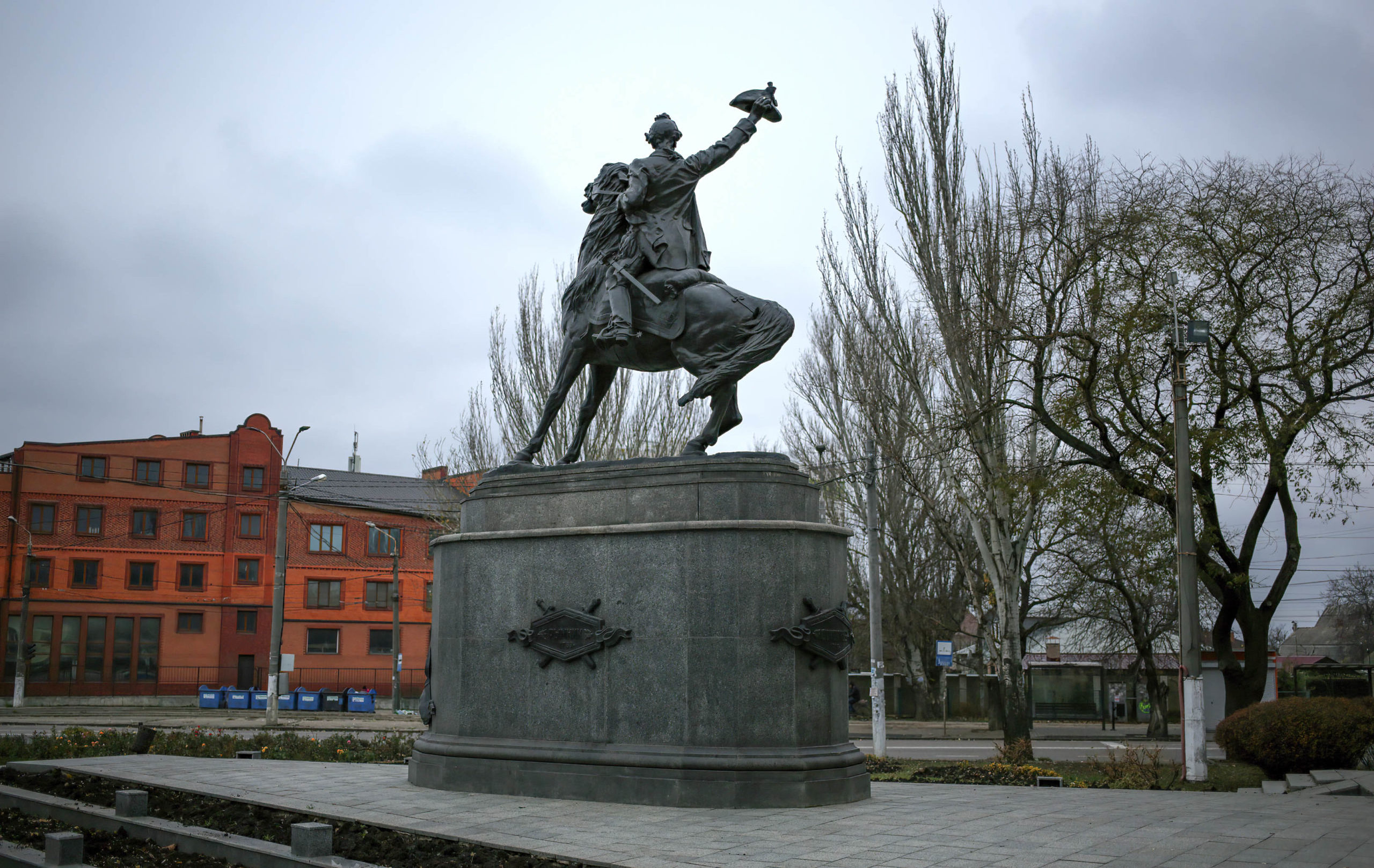 The monument to A.V. Suvorov is seen at the entrance to the