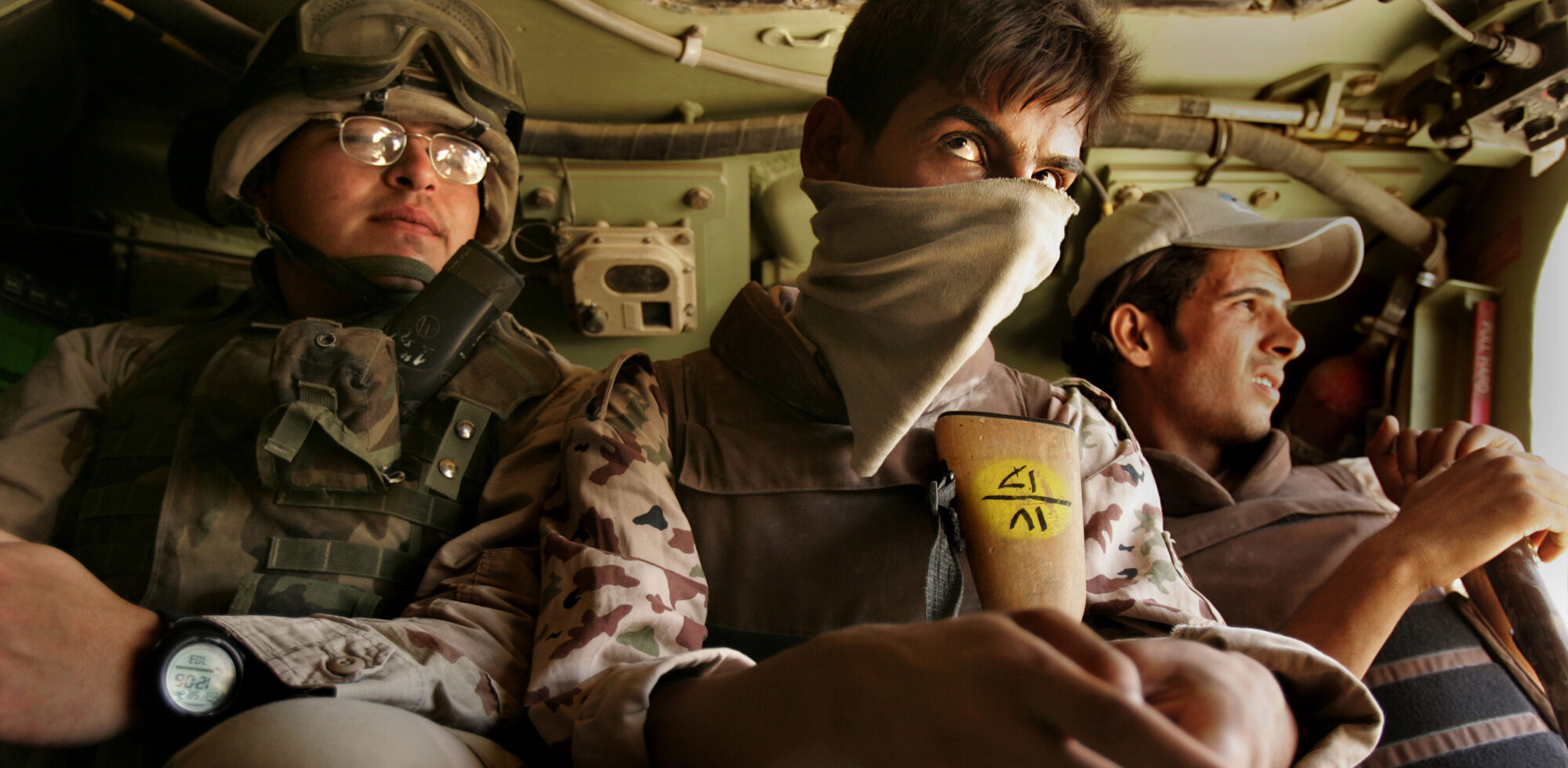 BAGHDAD, IRAQSpecialist Arturo Lima of US First Cavalry from Fort Hood Texas, left, and members of