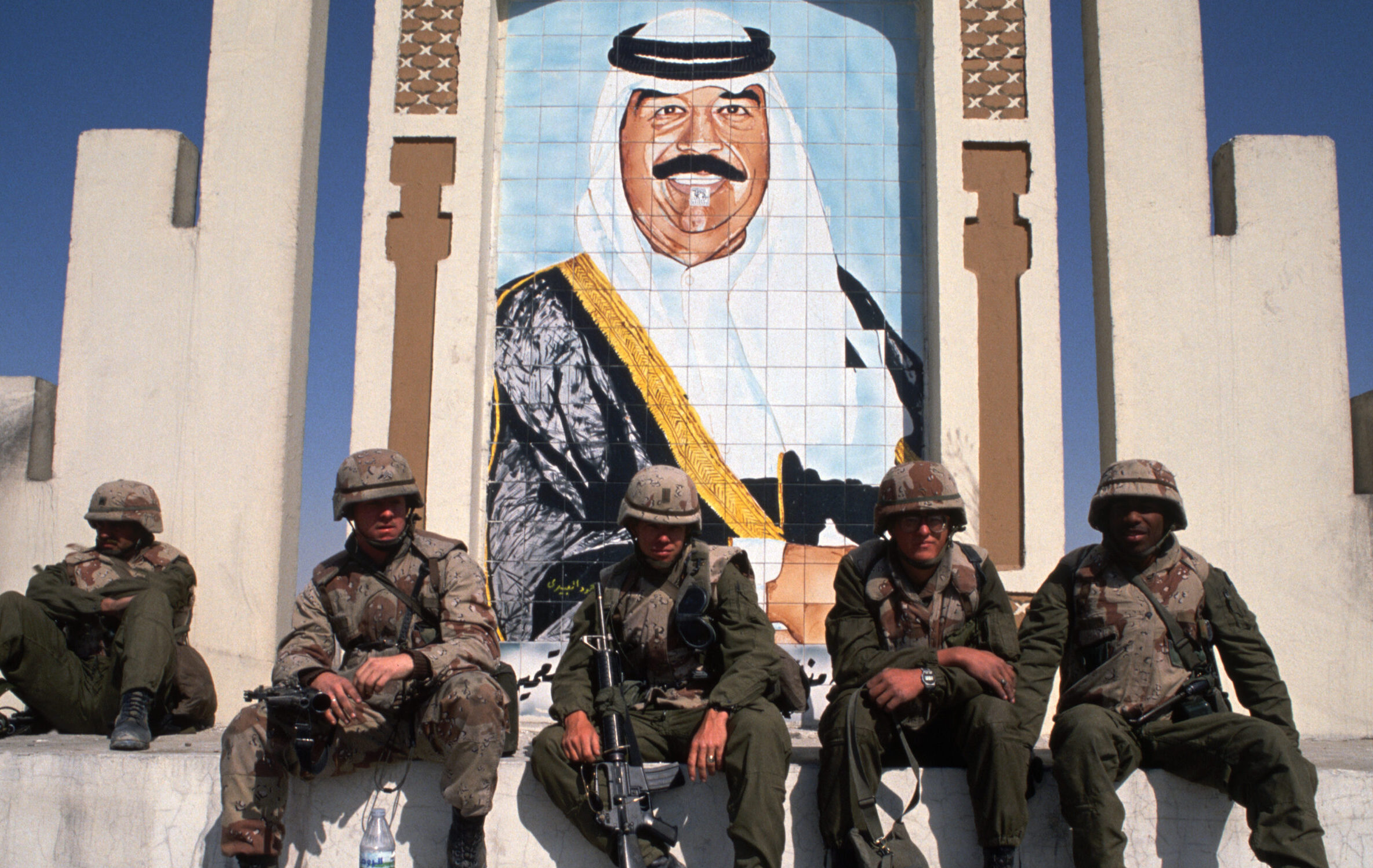 American Soldiers by Portrait of Saddam Hussein