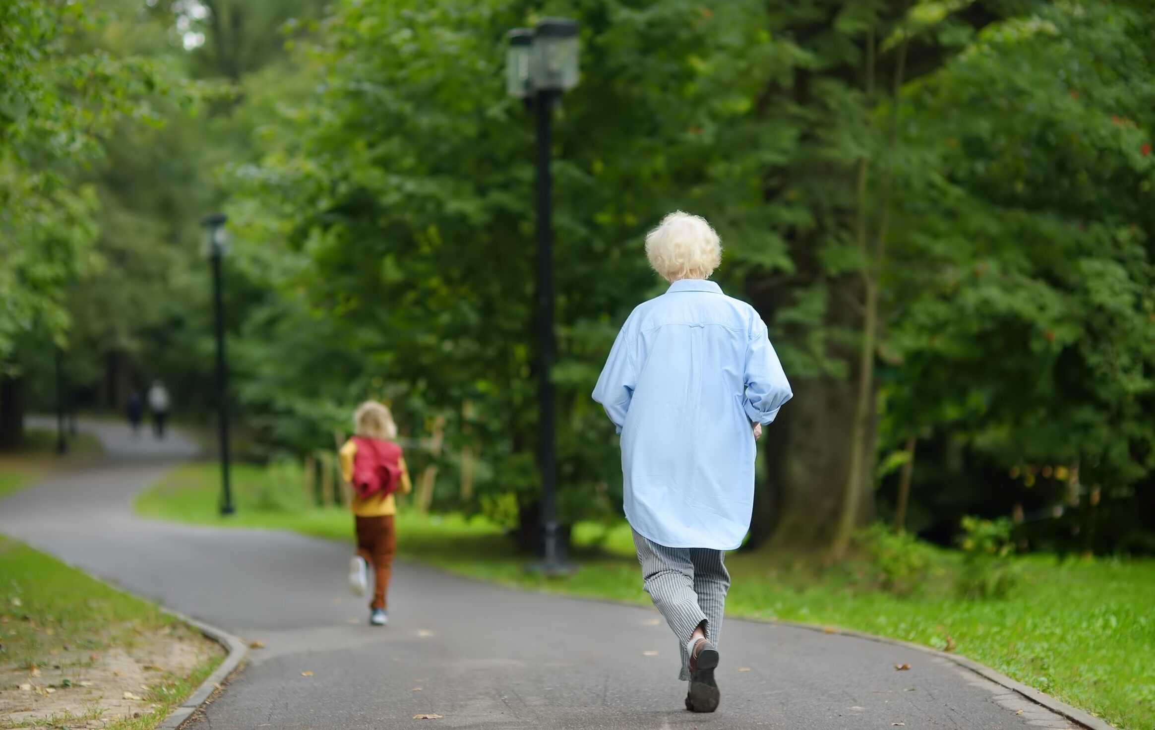 Little,Boy,Runs,Away,From,Babysitter,In,Summer,Park.,Elderly