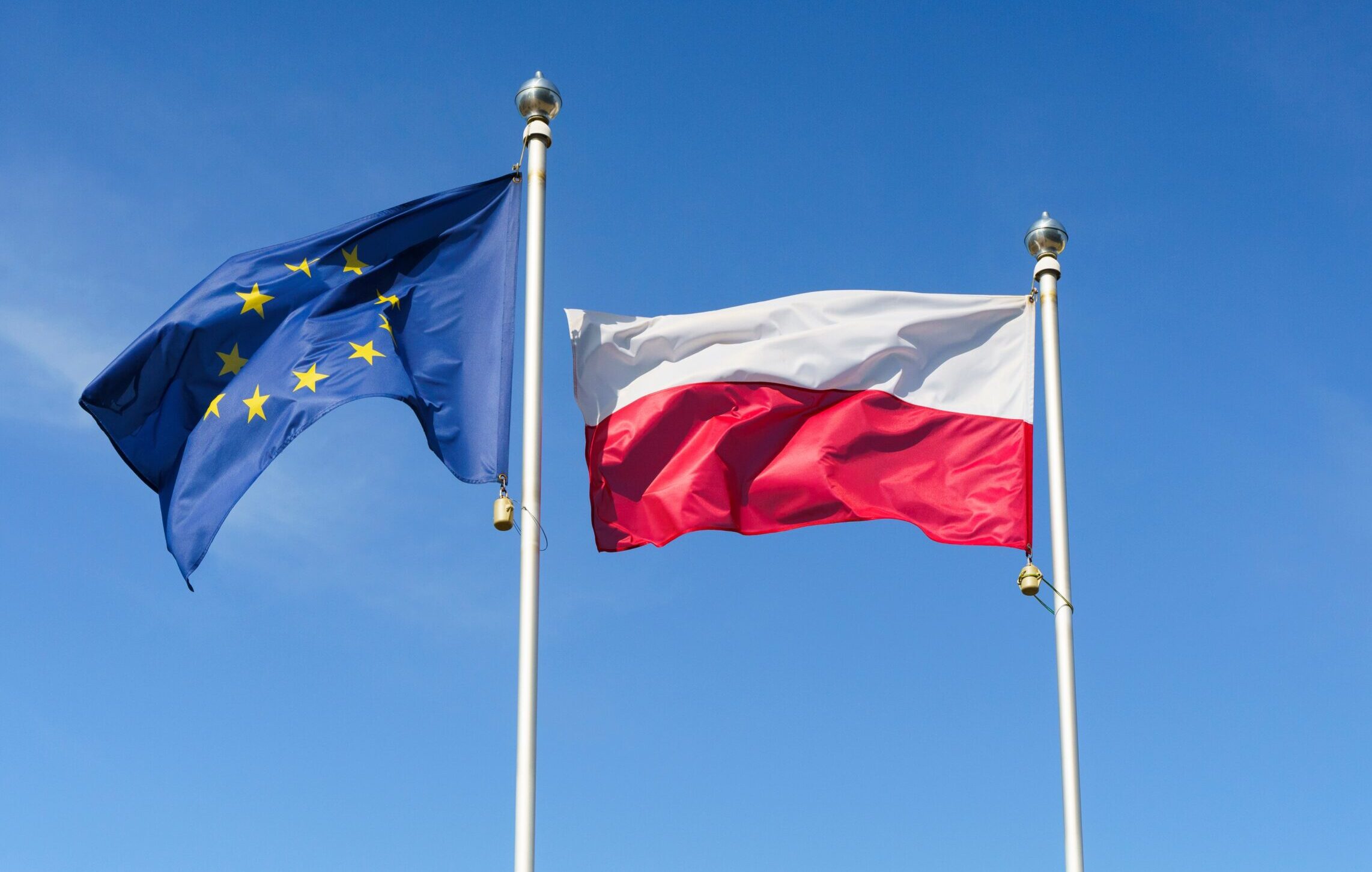 Flag,Of,Poland,And,The,European,Union,Against,The,Sky.