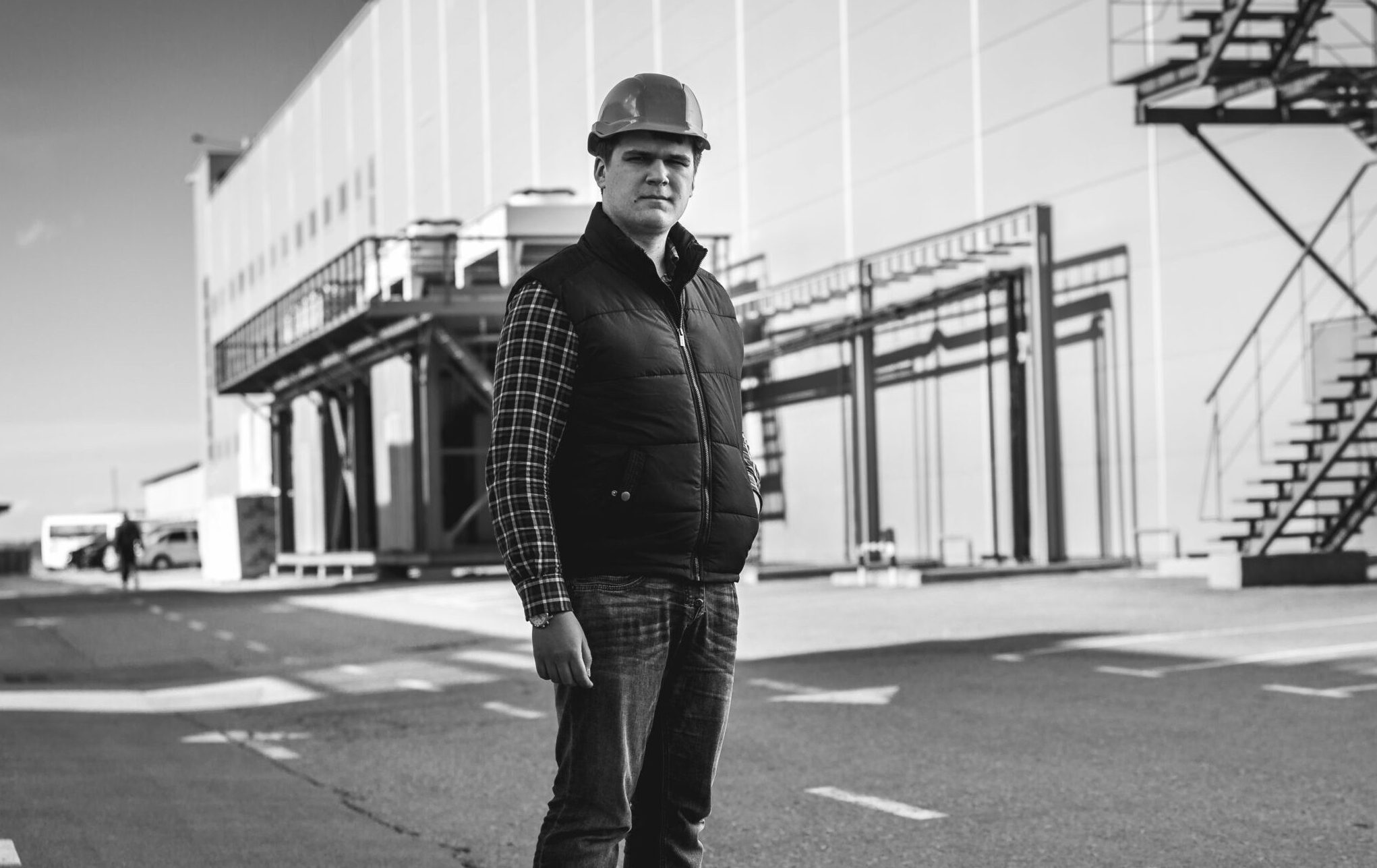 Black,And,White,Photo,Of,Handsome,Engineer,Standing,On,Building