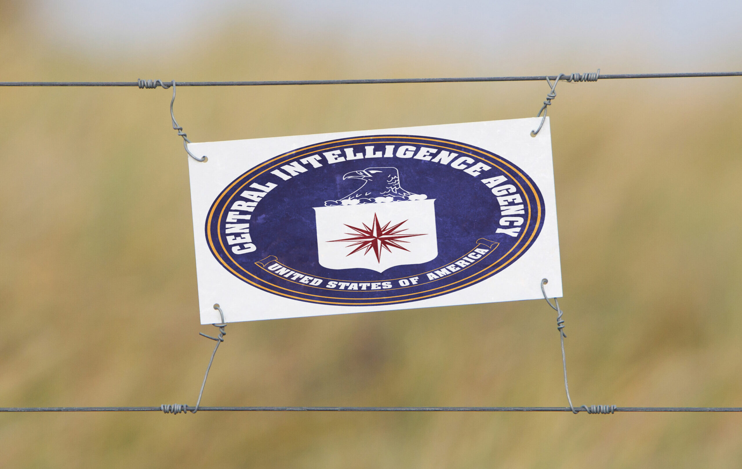 Border,Fence,-,Old,Plastic,Sign,With,A,Flag,-