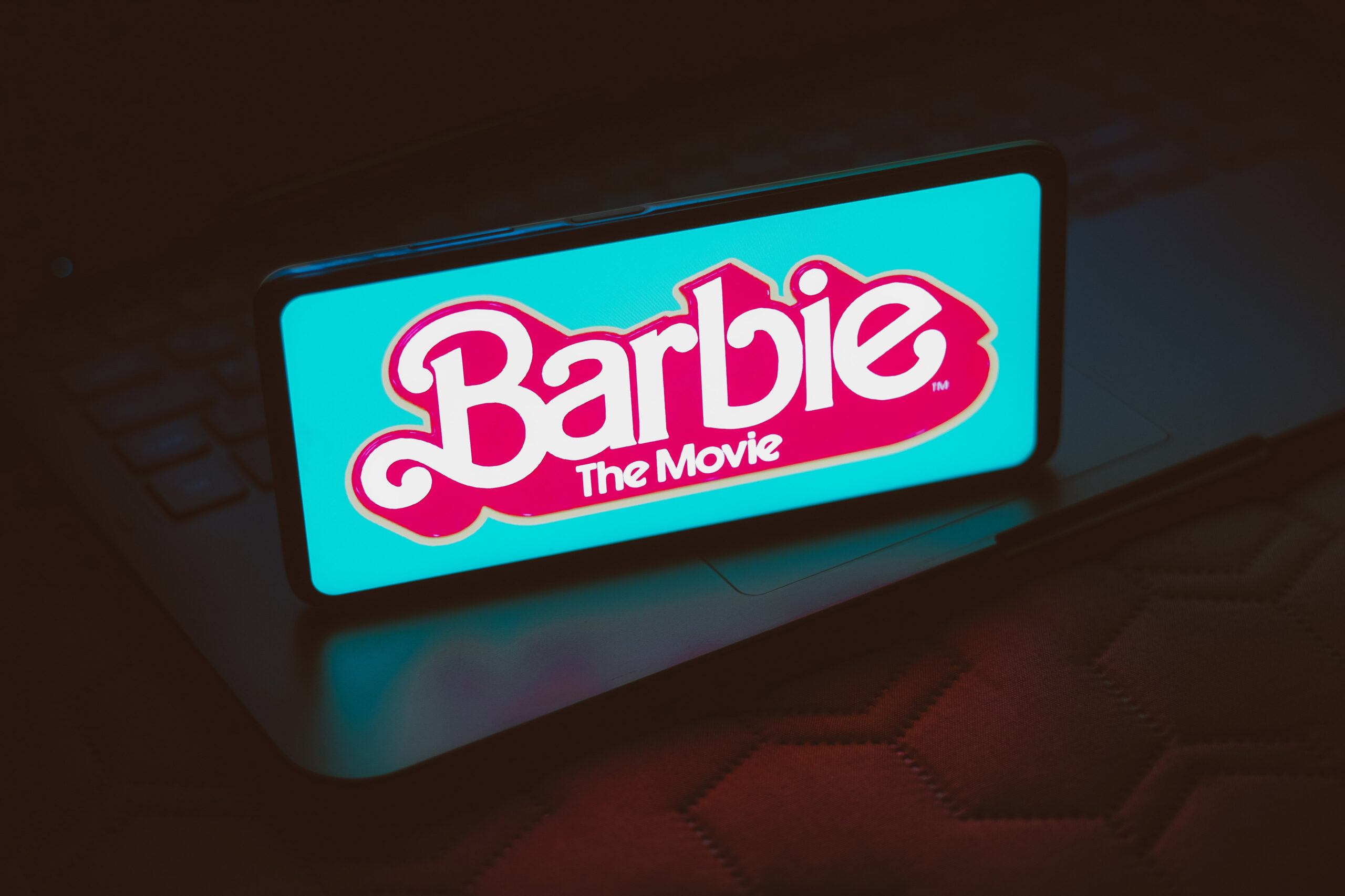 In this photo illustration, the Barbie the movie logo seen