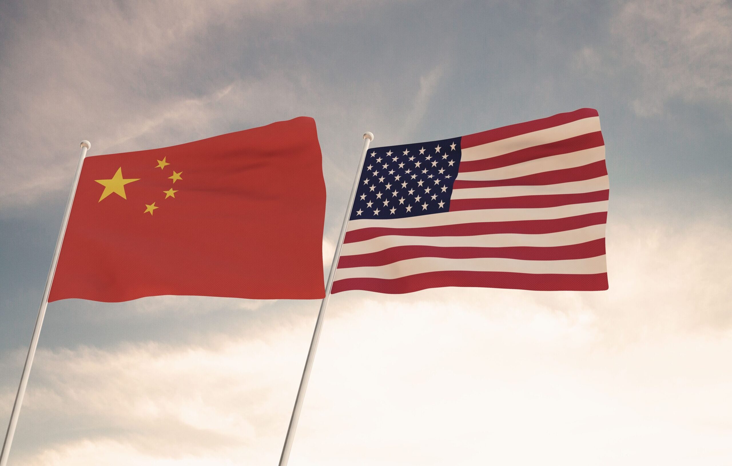 Flags,Of,China,And,Usa,Waving,With,Cloudy,Blue,Sky