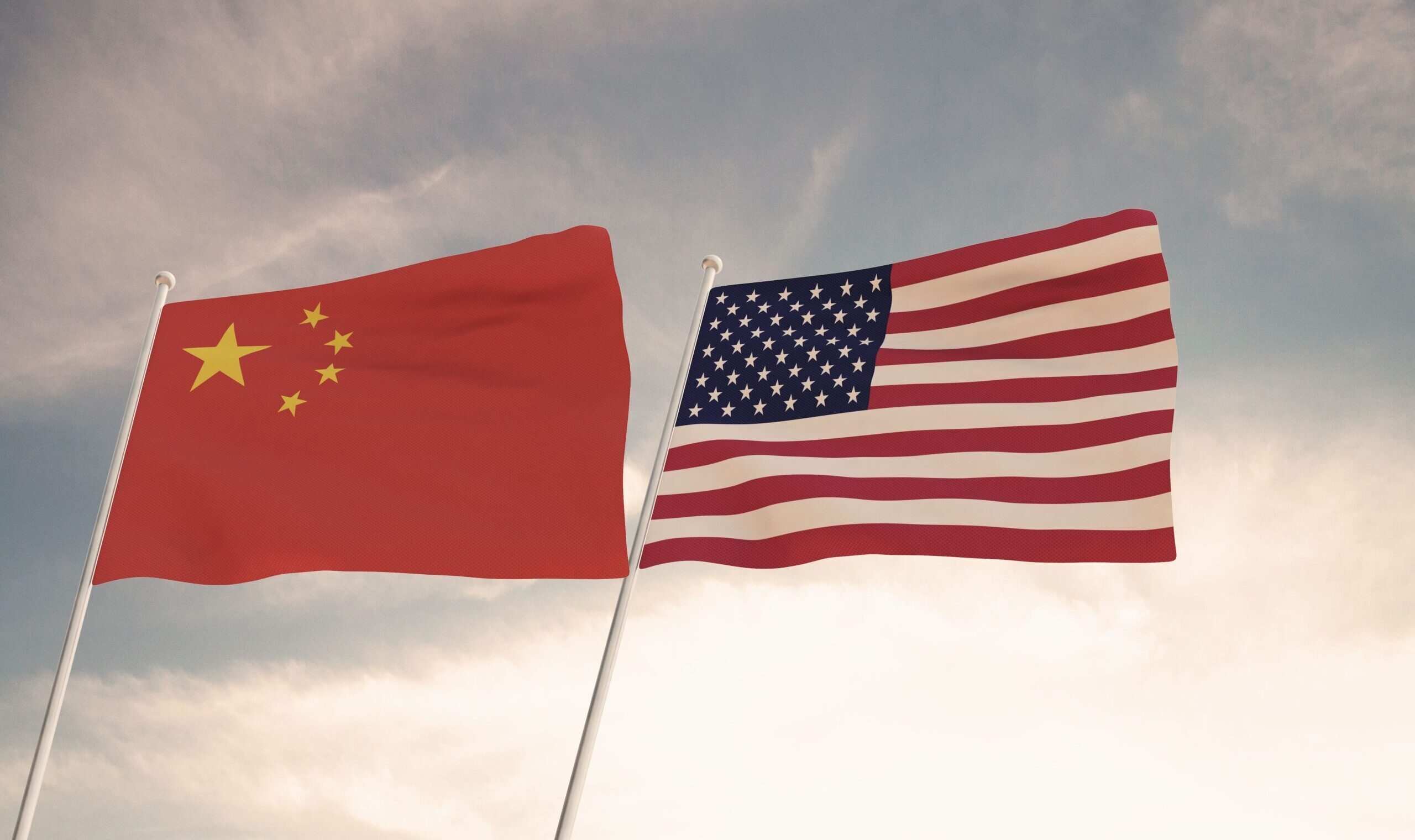 Flags,Of,China,And,Usa,Waving,With,Cloudy,Blue,Sky