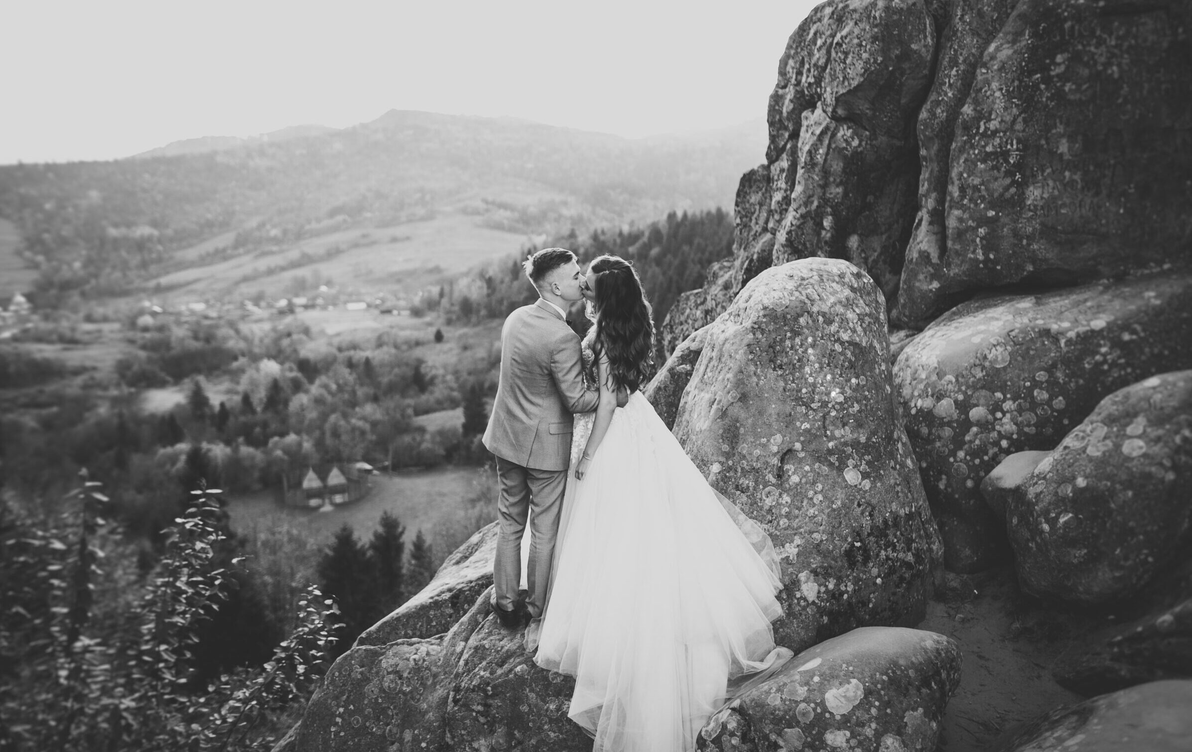 Loving,Husband,And,Woman,On,The,Background,Of,The,Mountains.
