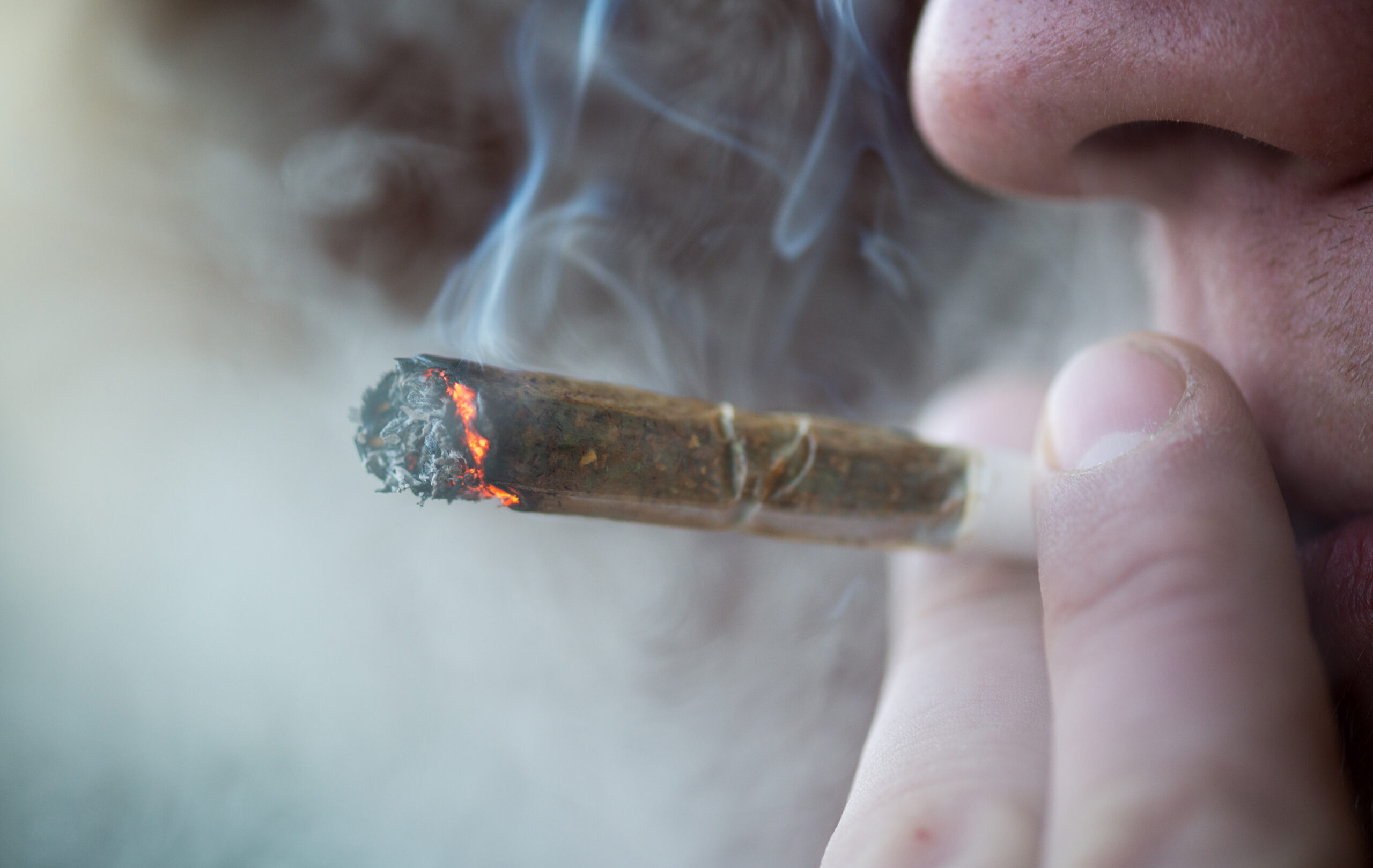 Man,Smoking,Marijuana,Cigarette,Soft,Drug,In,Amsterdam,,Netherlands