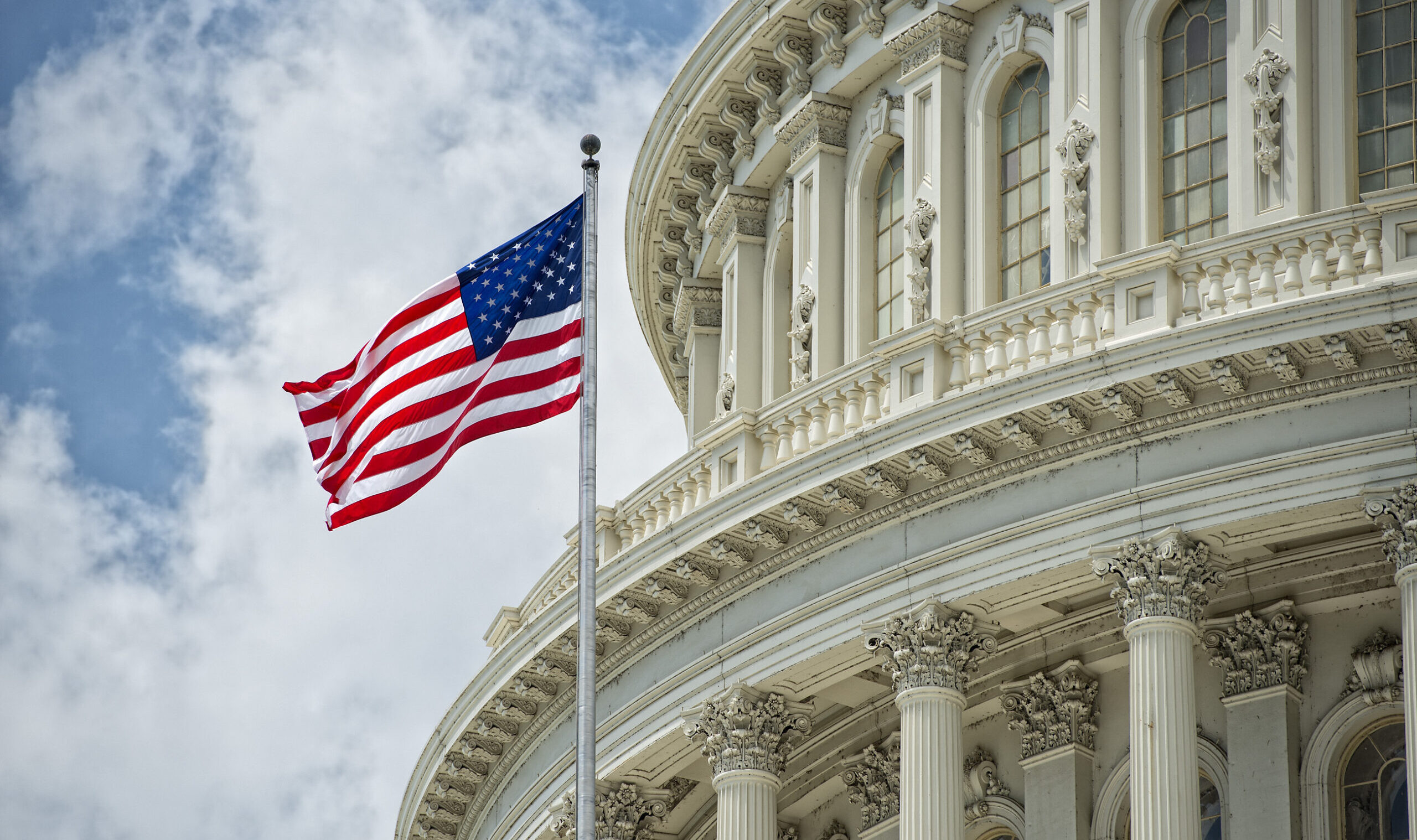 Washington,Dc,Capitol,Dome,Detail,With,Waving,American,Flag