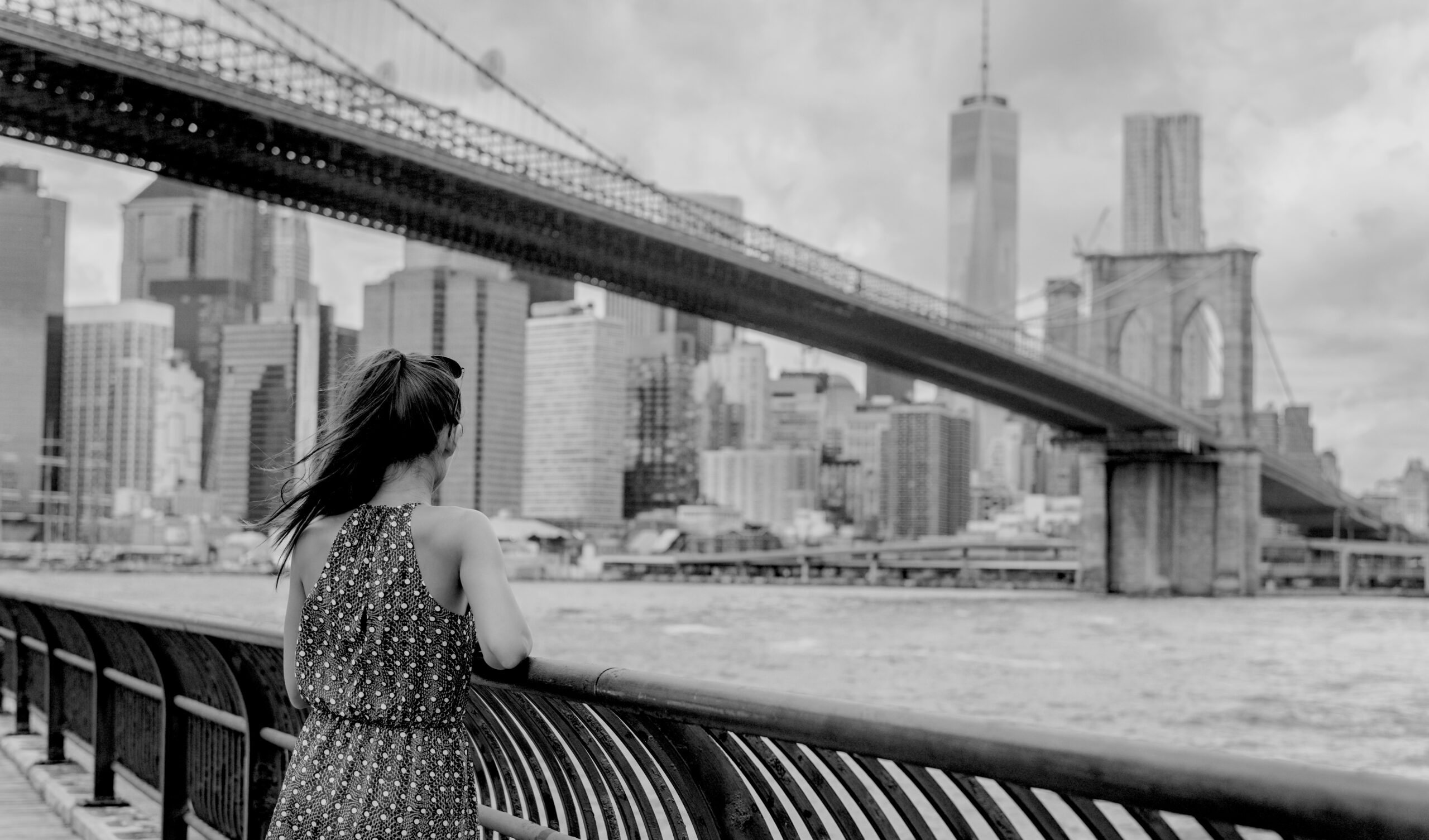 New,York,City,Woman,Looking,At,Brooklyn,Bridge,And,View