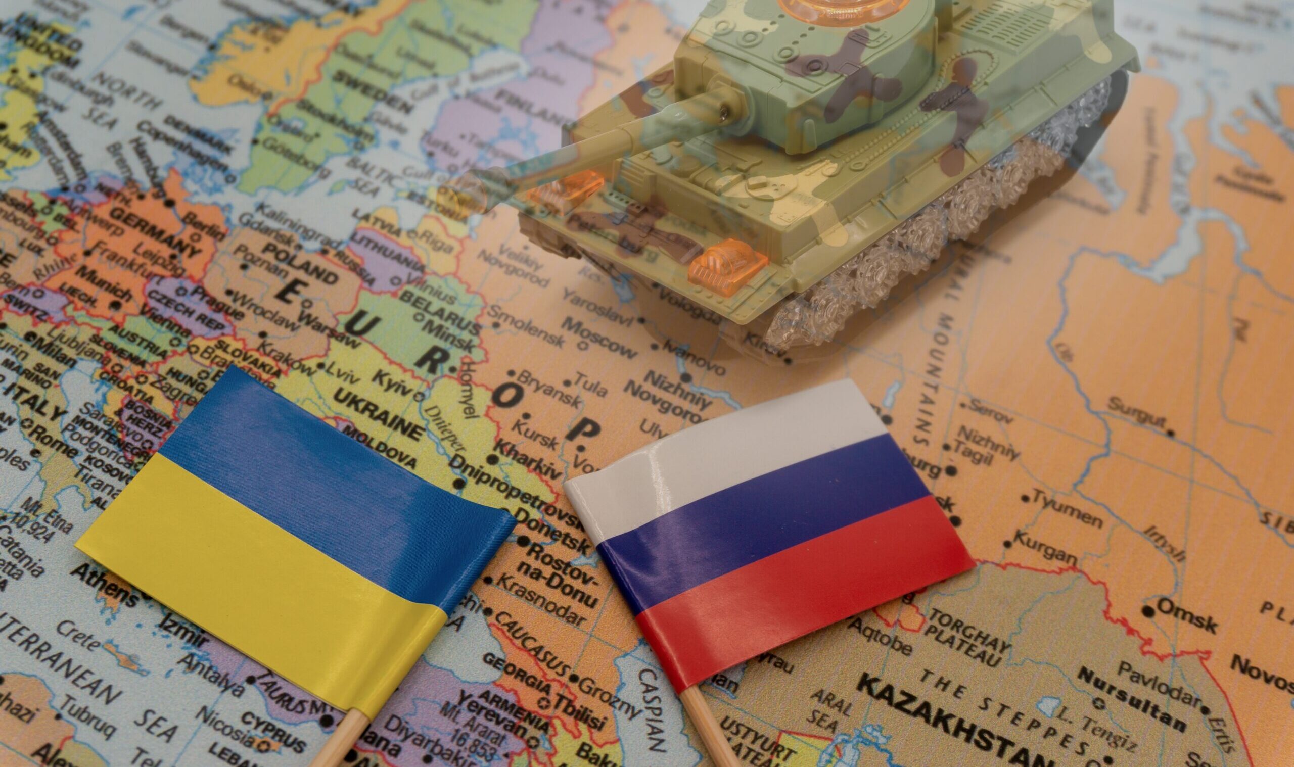 Ukrainian,And,Russian,Flags,Placed,On,A,Map,Of,Europe.