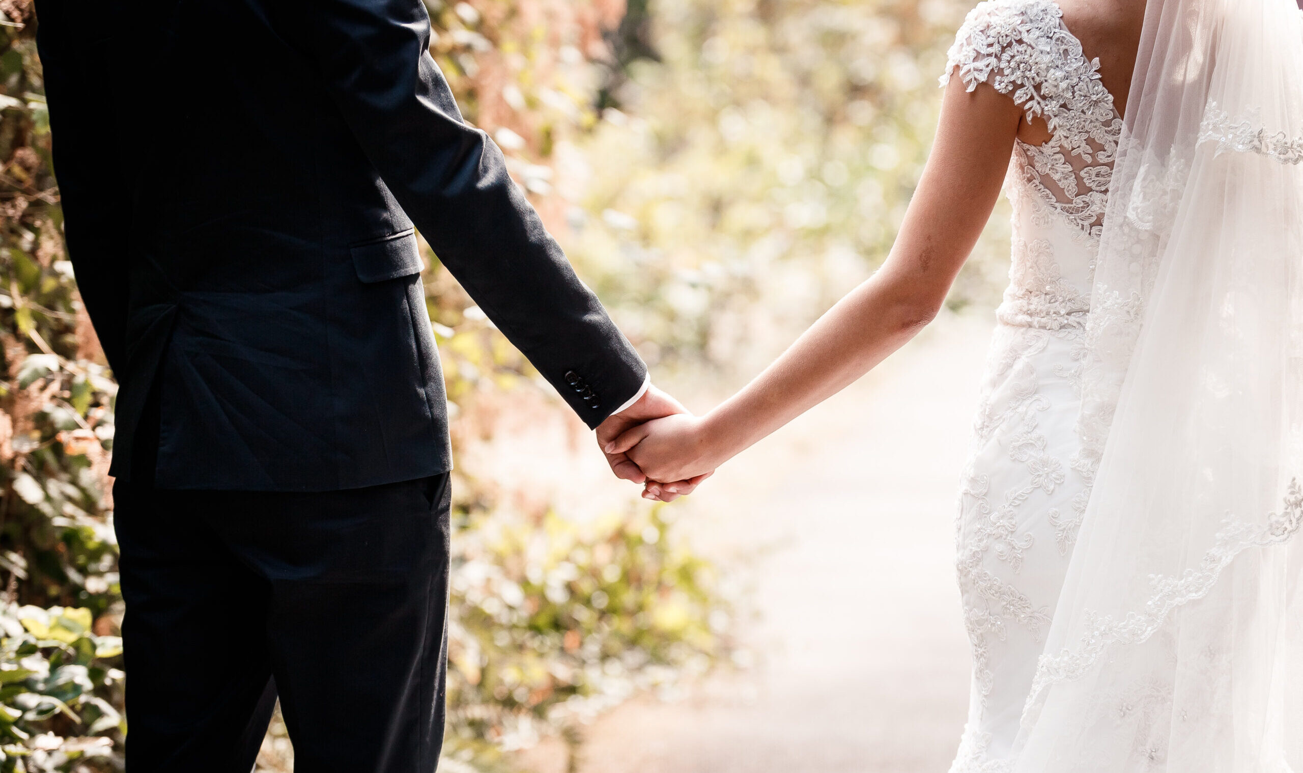 The,Hands,Of,The,Bride,And,Groom,Touch,Each,Other.gentle