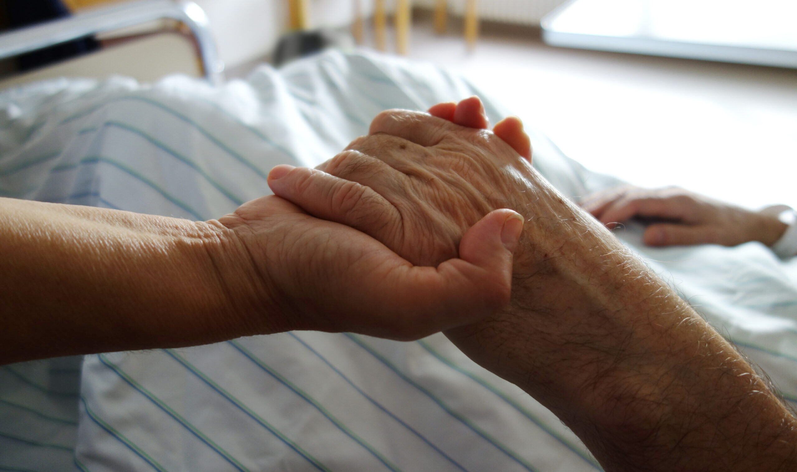 Nurse,Holding,A,Hand,Of,A,Patient