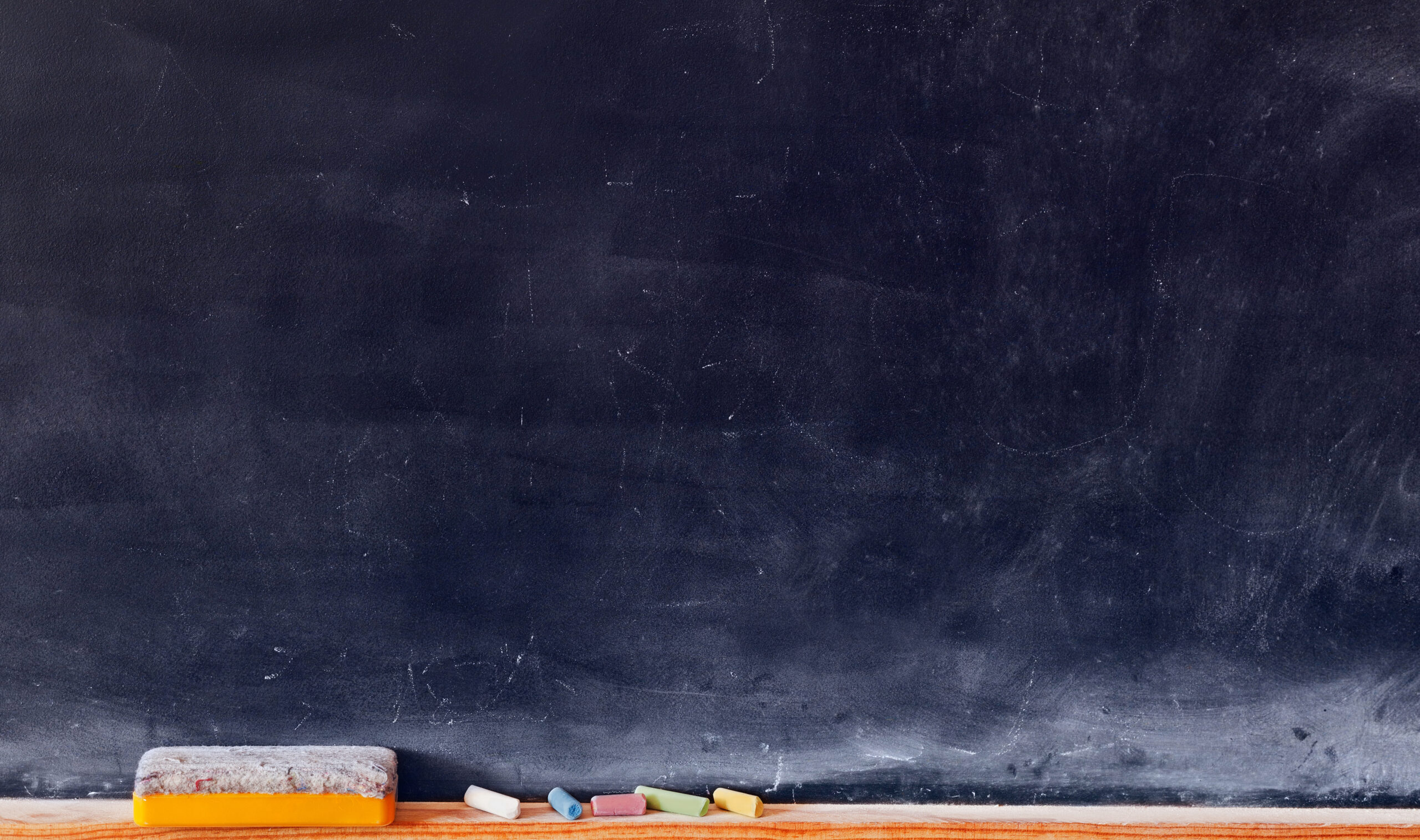 Blank,Blackboard,With,Colored,Chalks,And,Eraser.,Horizontal,Composition.