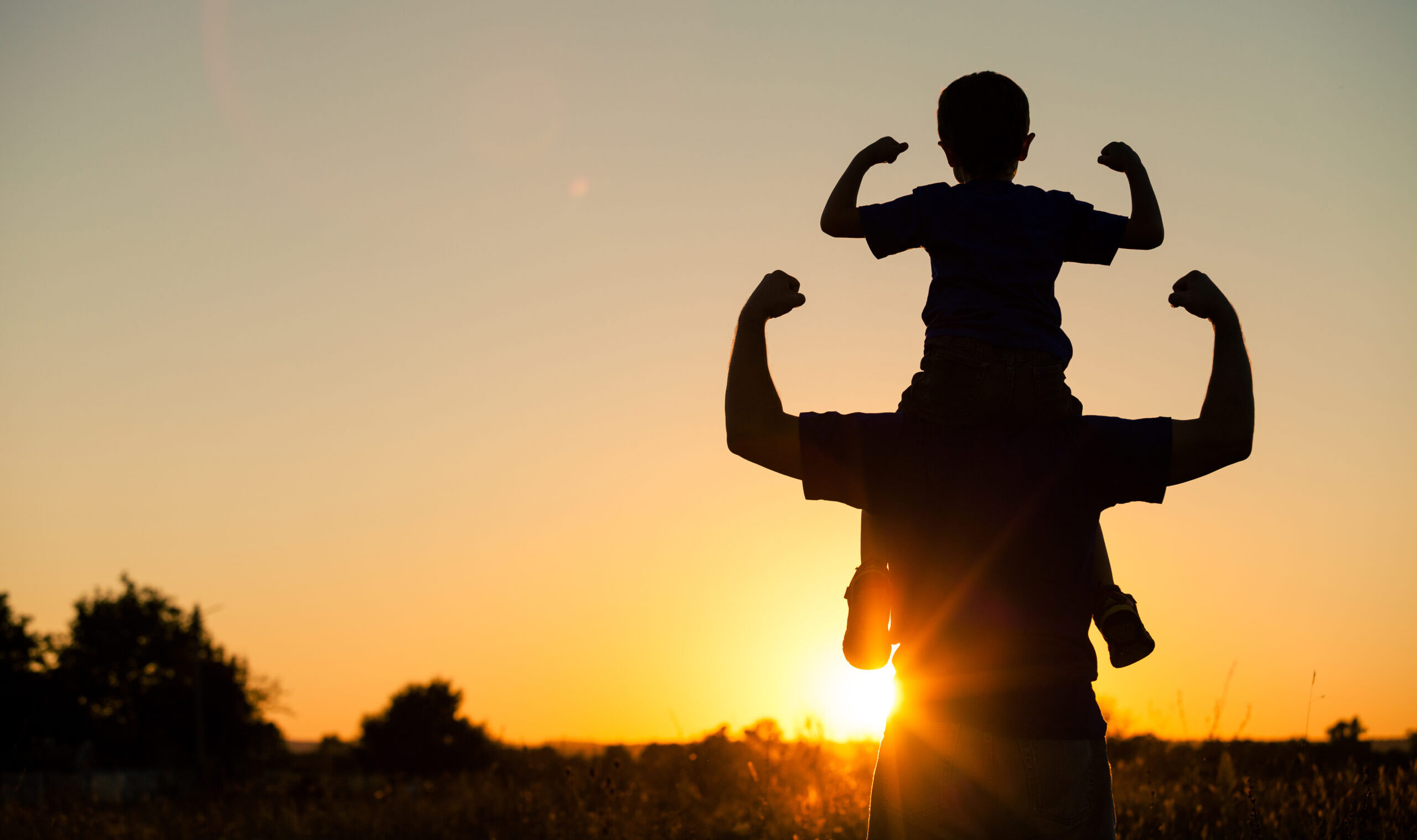 Father,And,Son,Playing,In,The,Park,At,The,Sunset