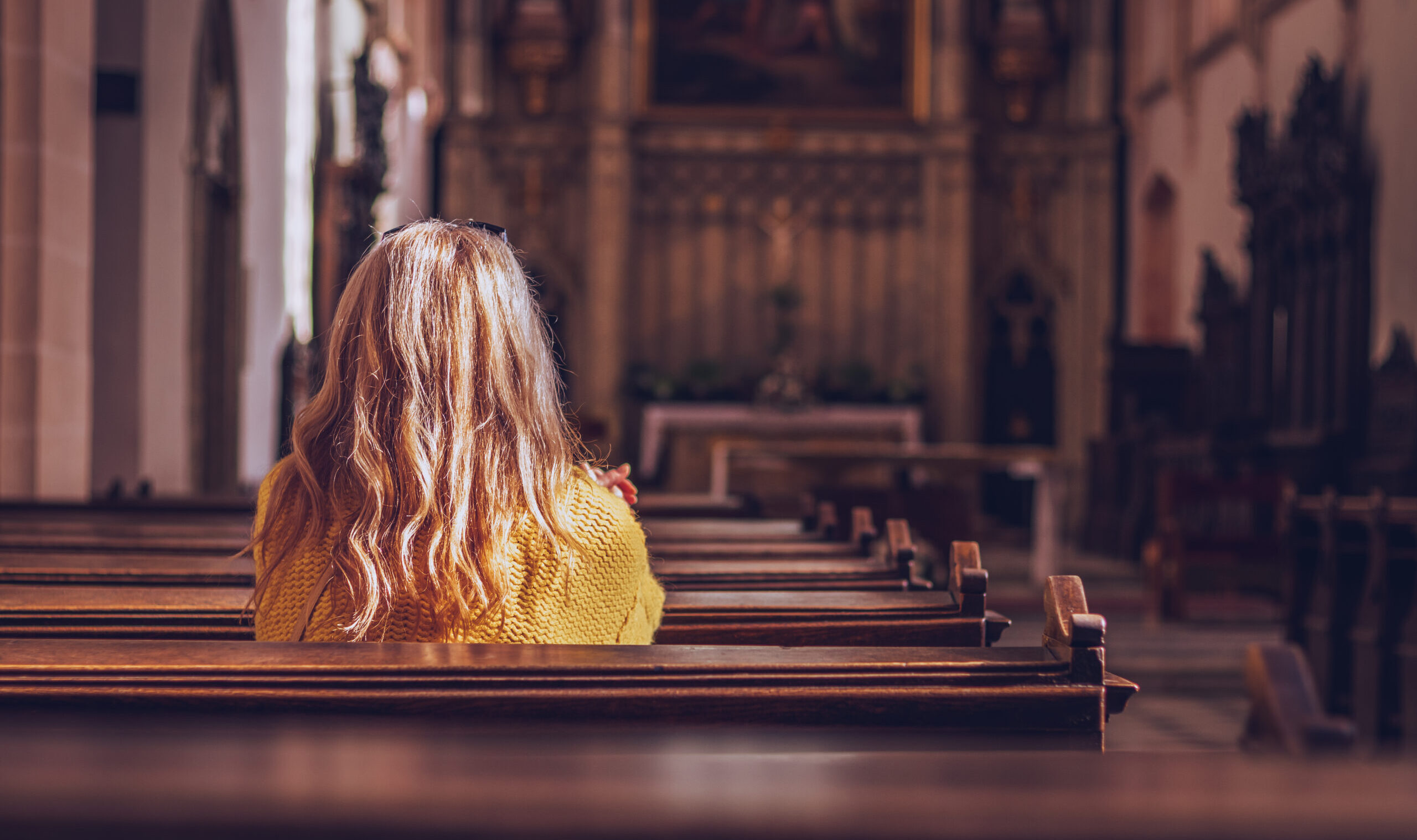 Young,Woman,Praying,And,Meditating,In,Church.,Belief,In,Jesus